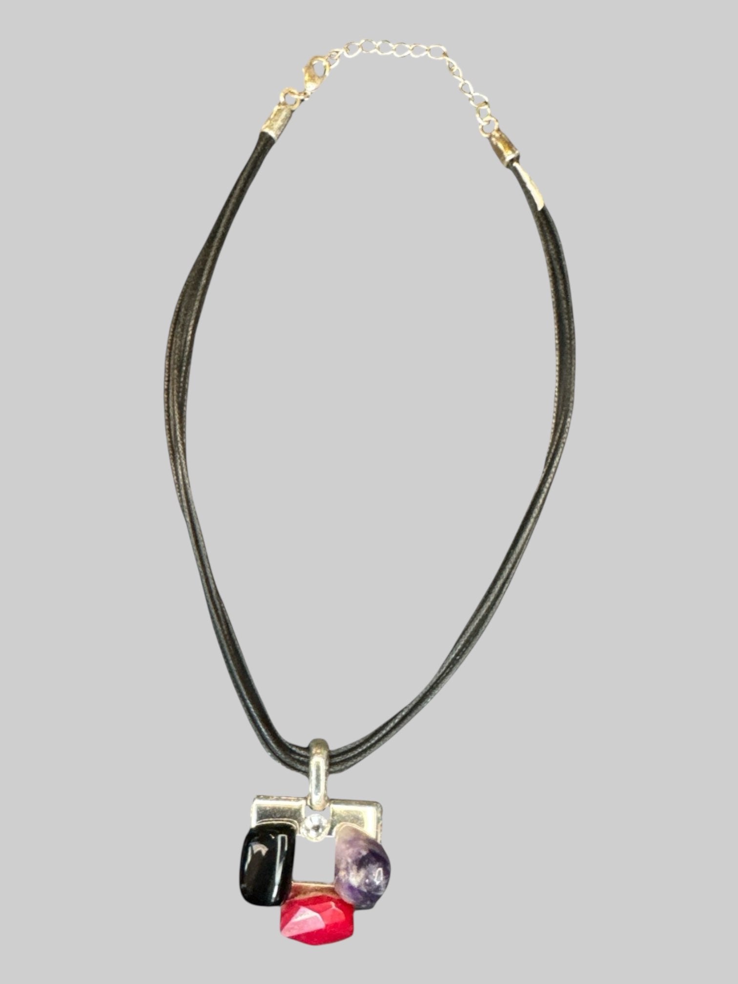 Adjustable necklace with multiple braided strands, and multi gemstone pendant