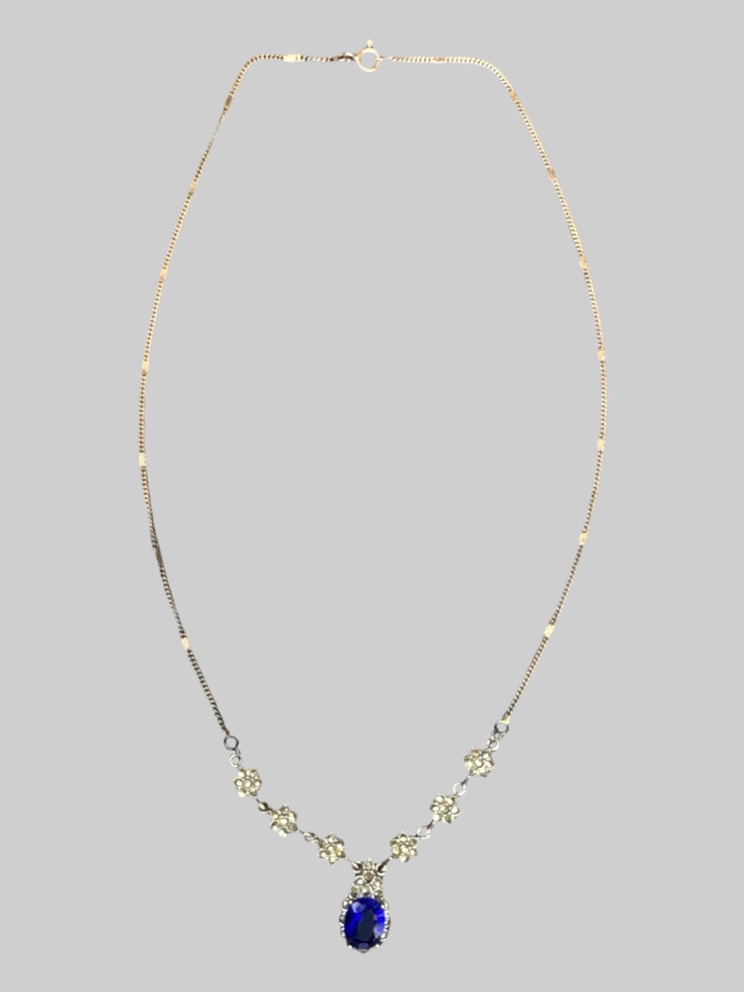 Sapphire tone pendant necklace with rhinestone flowers