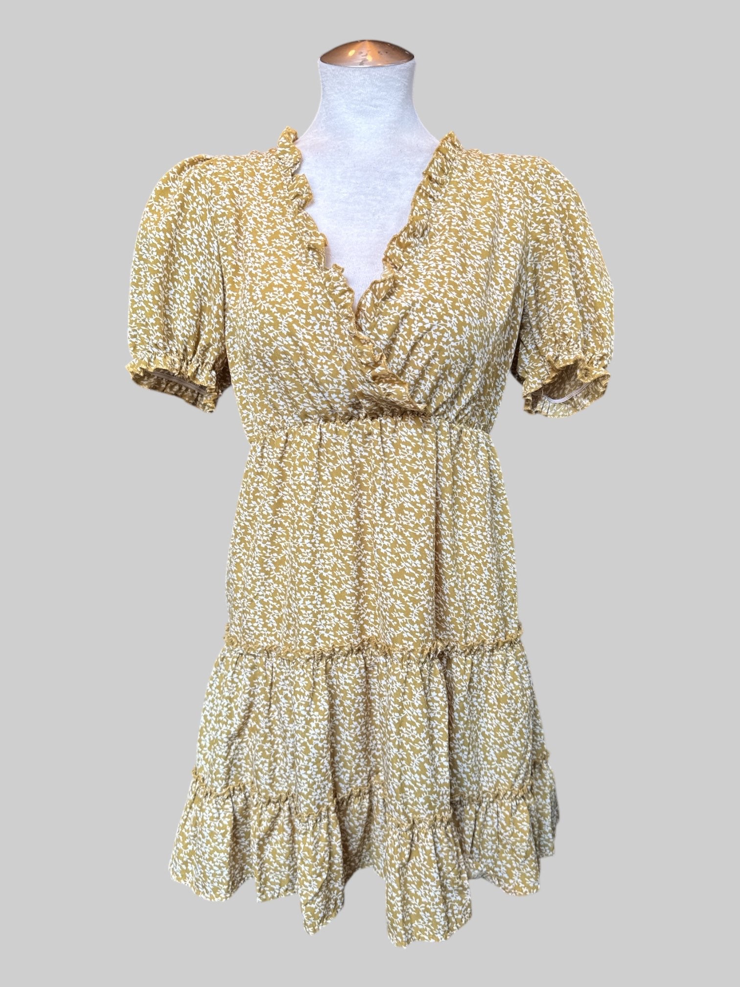 S Short green tiered flowy dress with ruffle neckline and white florals
