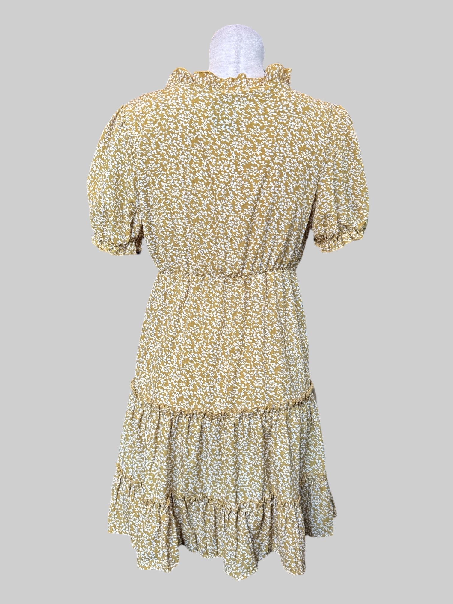 S Short green tiered flowy dress with ruffle neckline and white florals