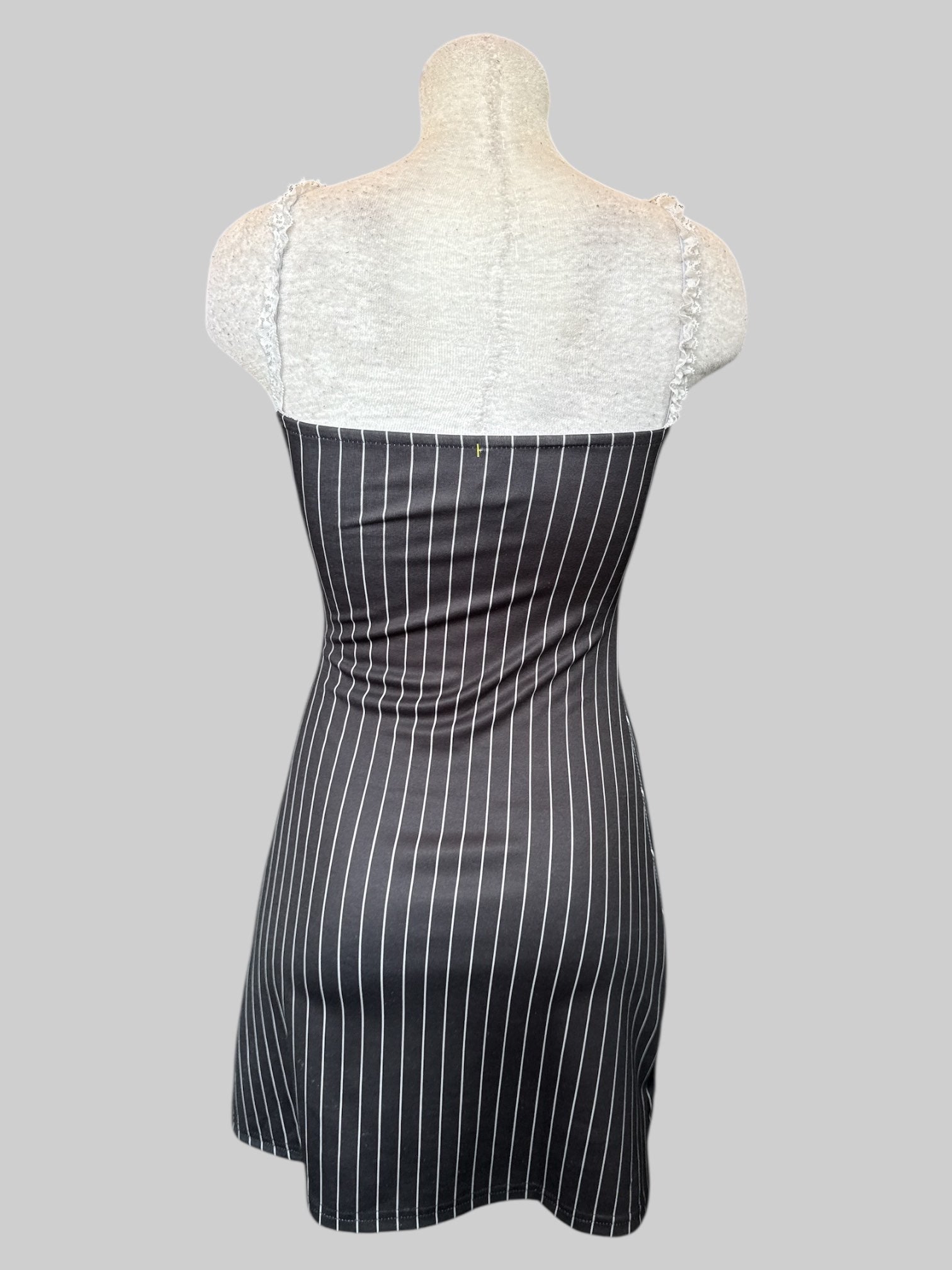 S Black and white pinstriped body con dress with lace and bow tie in front
