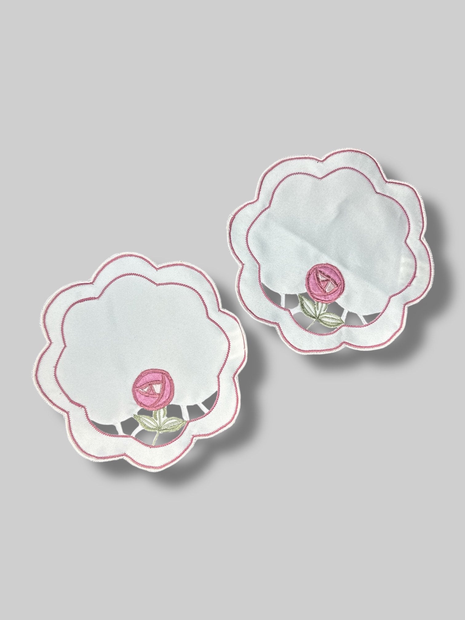 Pair of flower shaped doilies with rose design