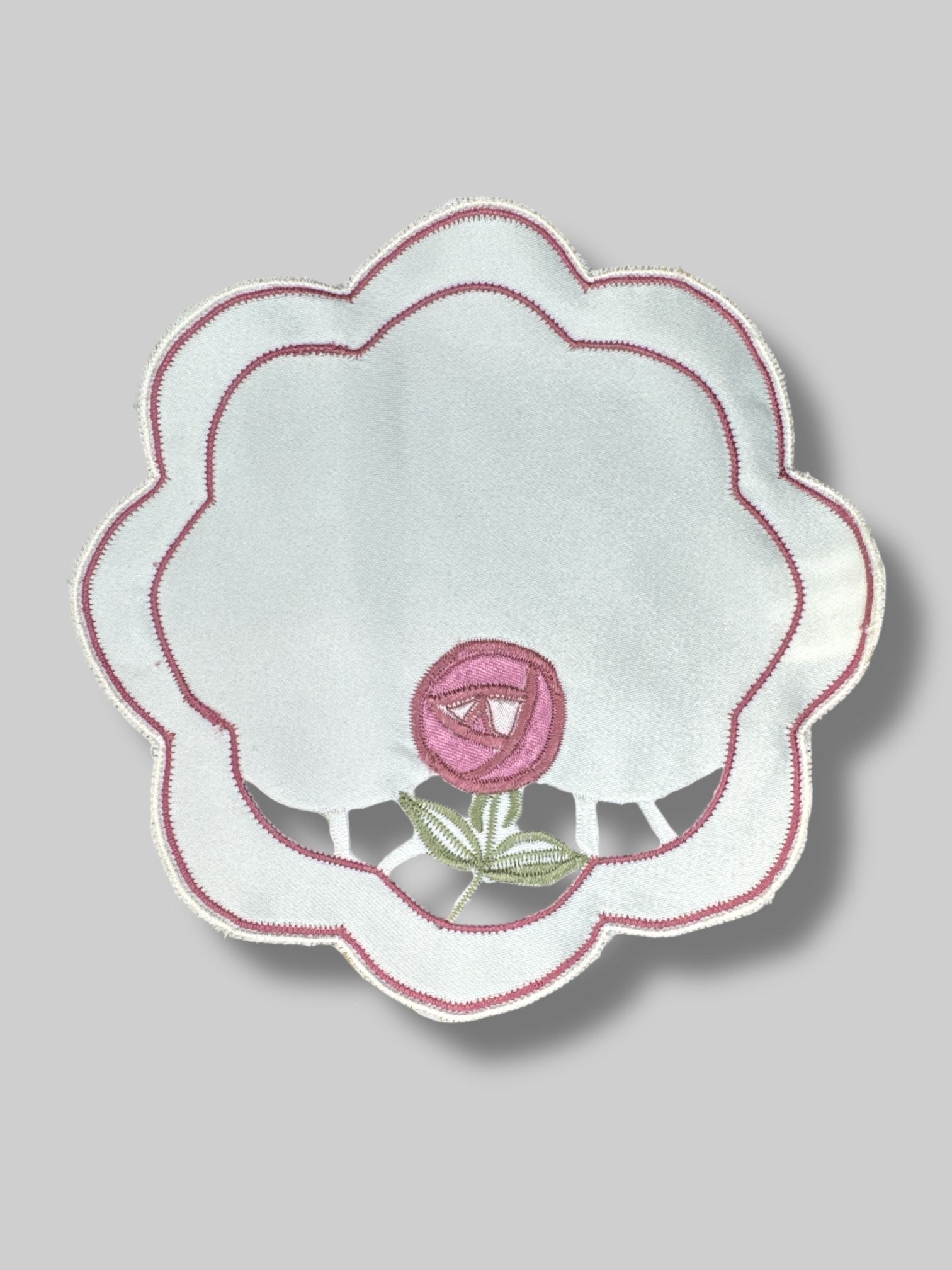 Pair of flower shaped doilies with rose design