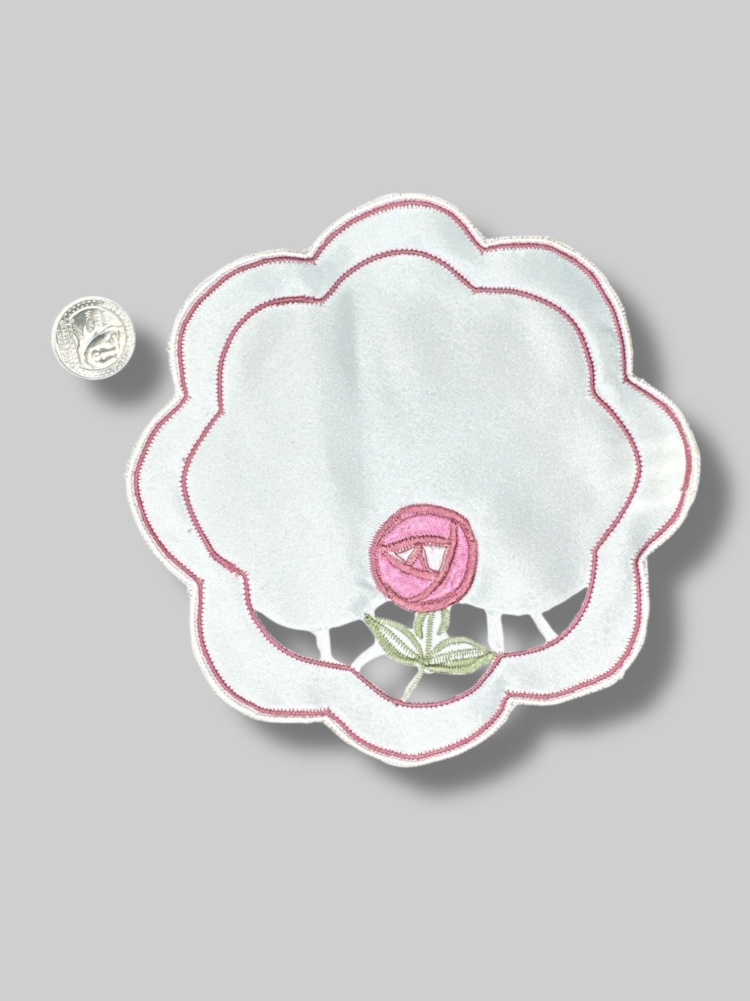 Pair of flower shaped doilies with rose design