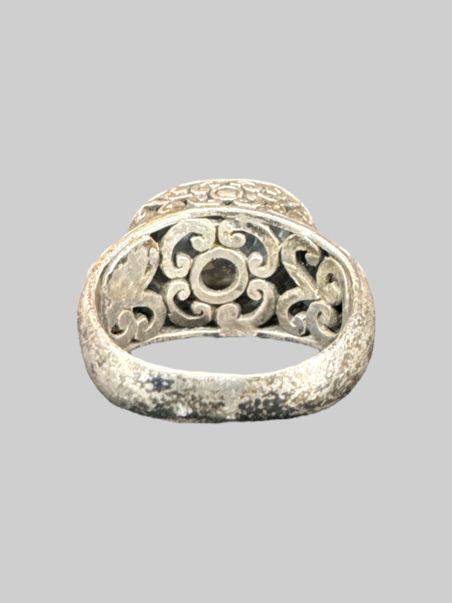 * Sterling silver ornate ring with light blue gem