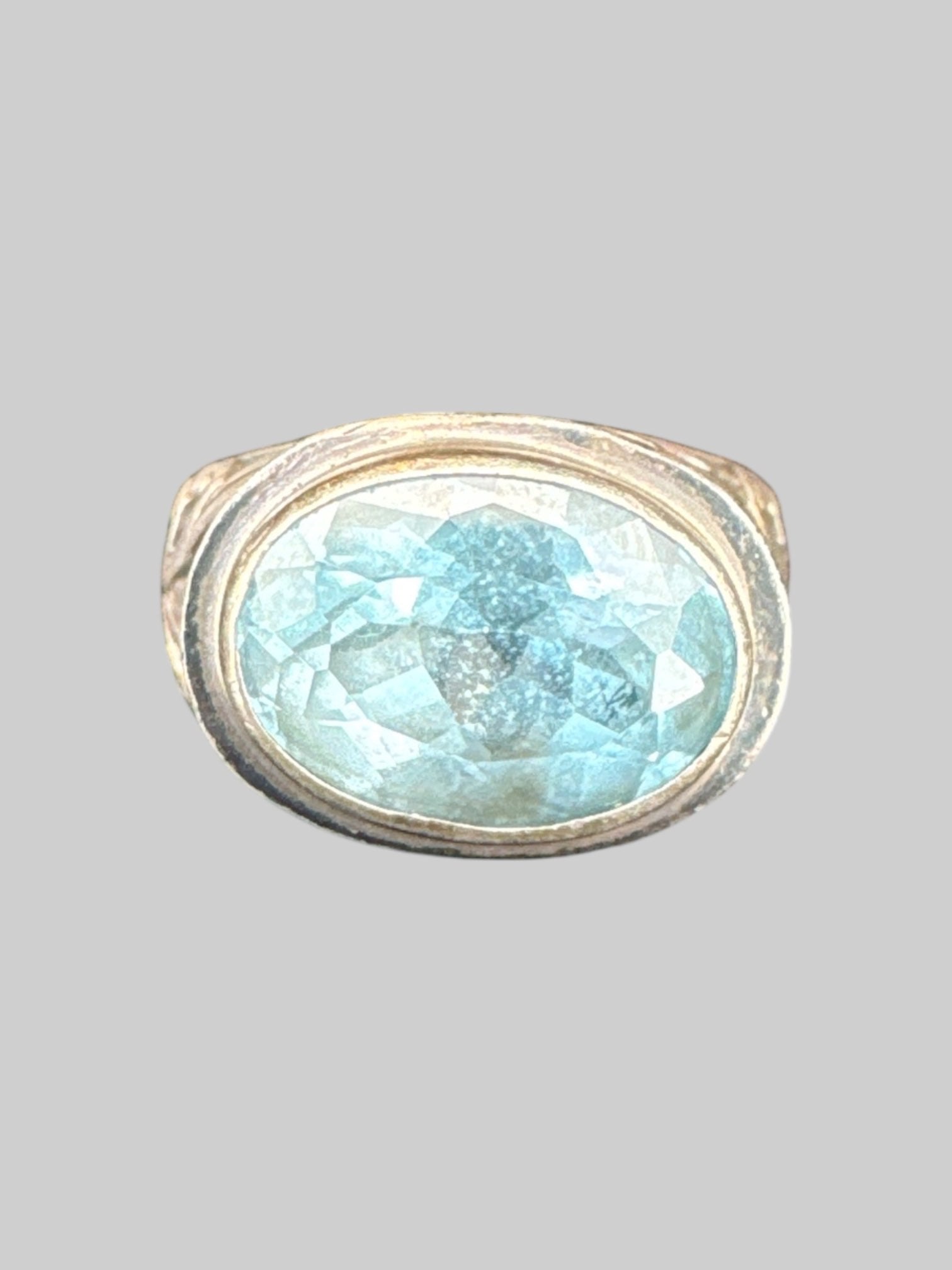 * Sterling silver ornate ring with light blue gem