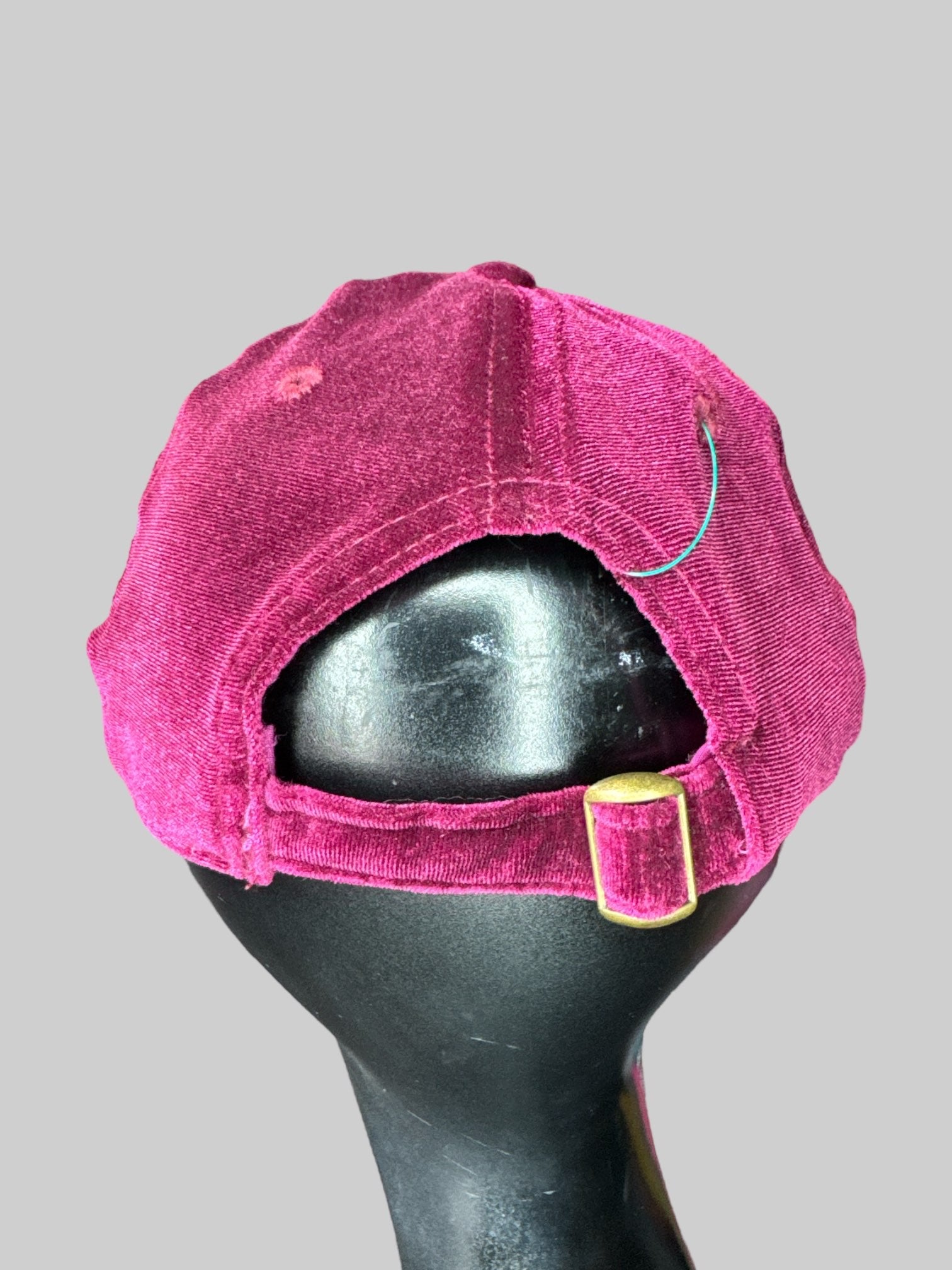 Maroon velvet baseball cap with brass tone buckle