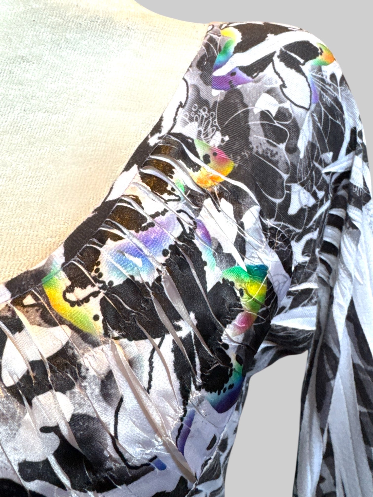 L Tunic style top with black, white, and rainbow designs and 3/4 sleeves
