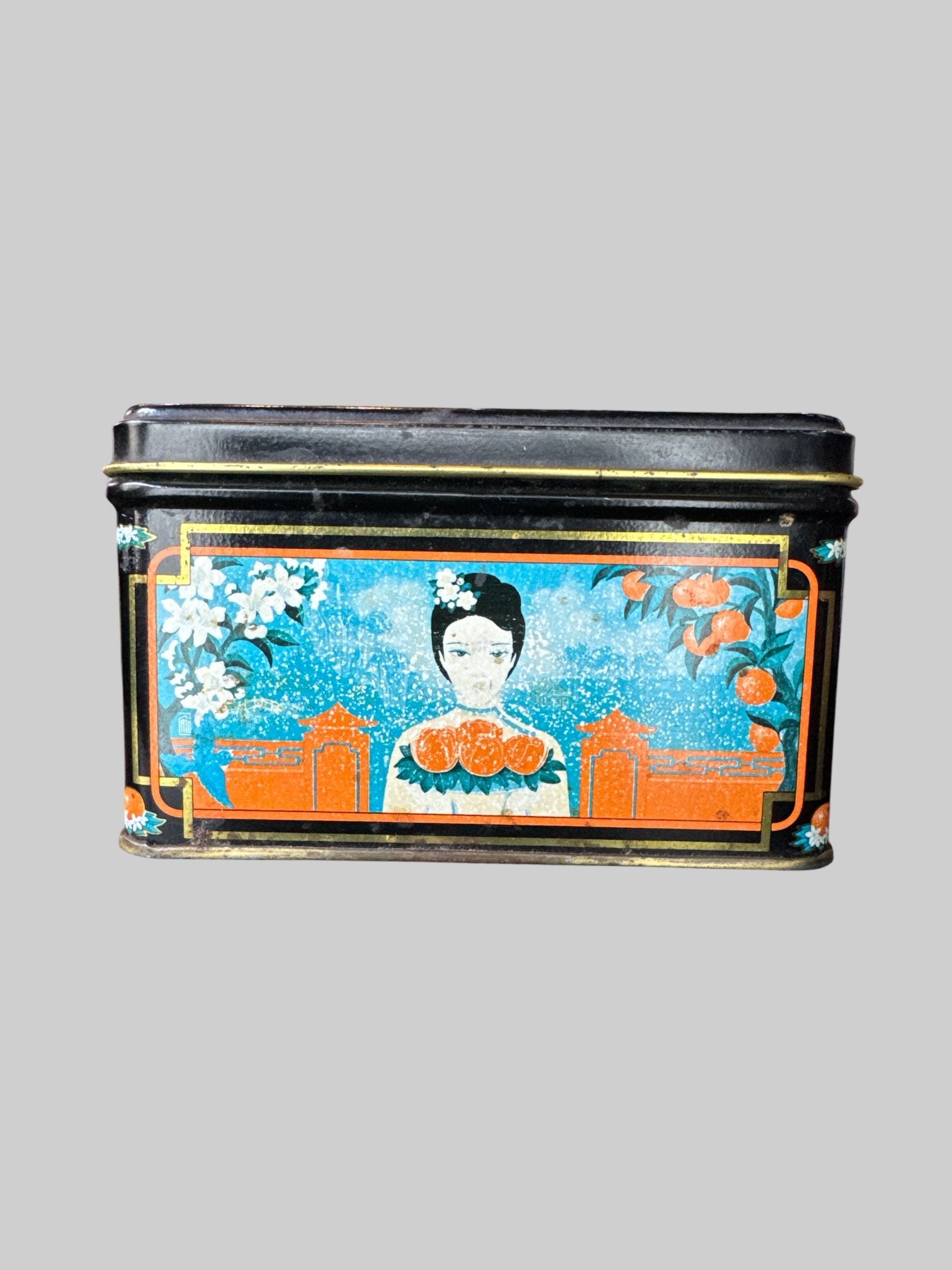 Vintage metal tea tin with gold tone inside