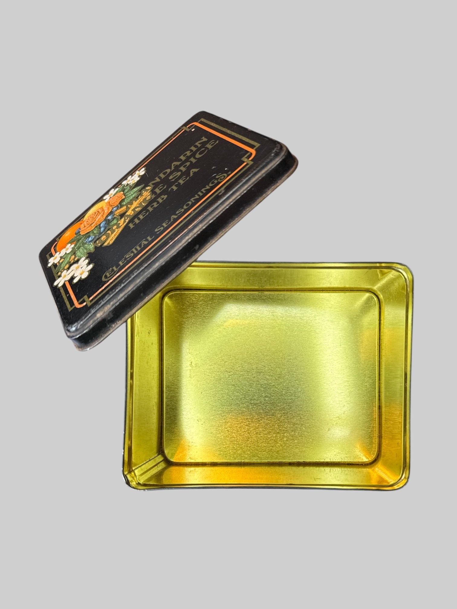 Vintage metal tea tin with gold tone inside