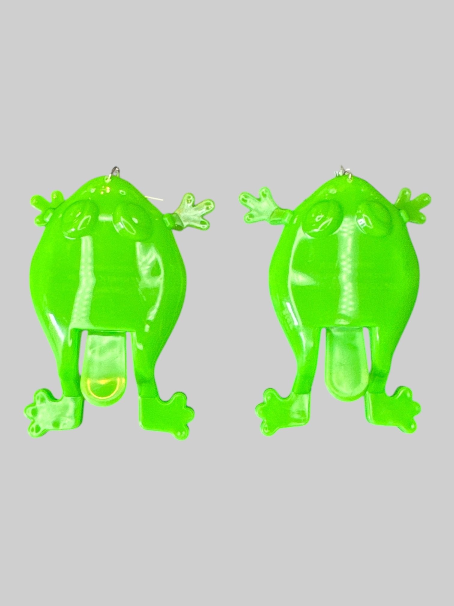 Green toy frog earrings