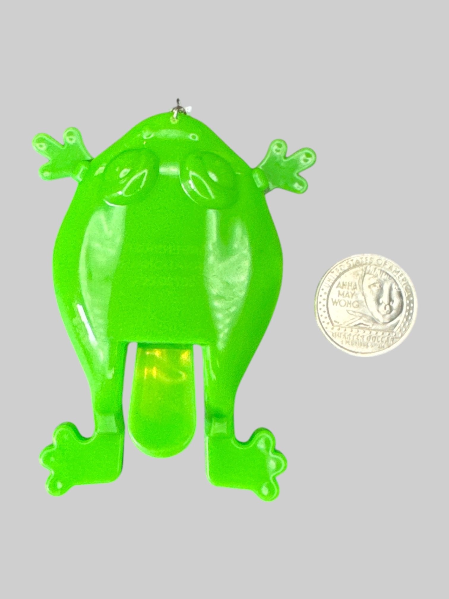 Green toy frog earrings