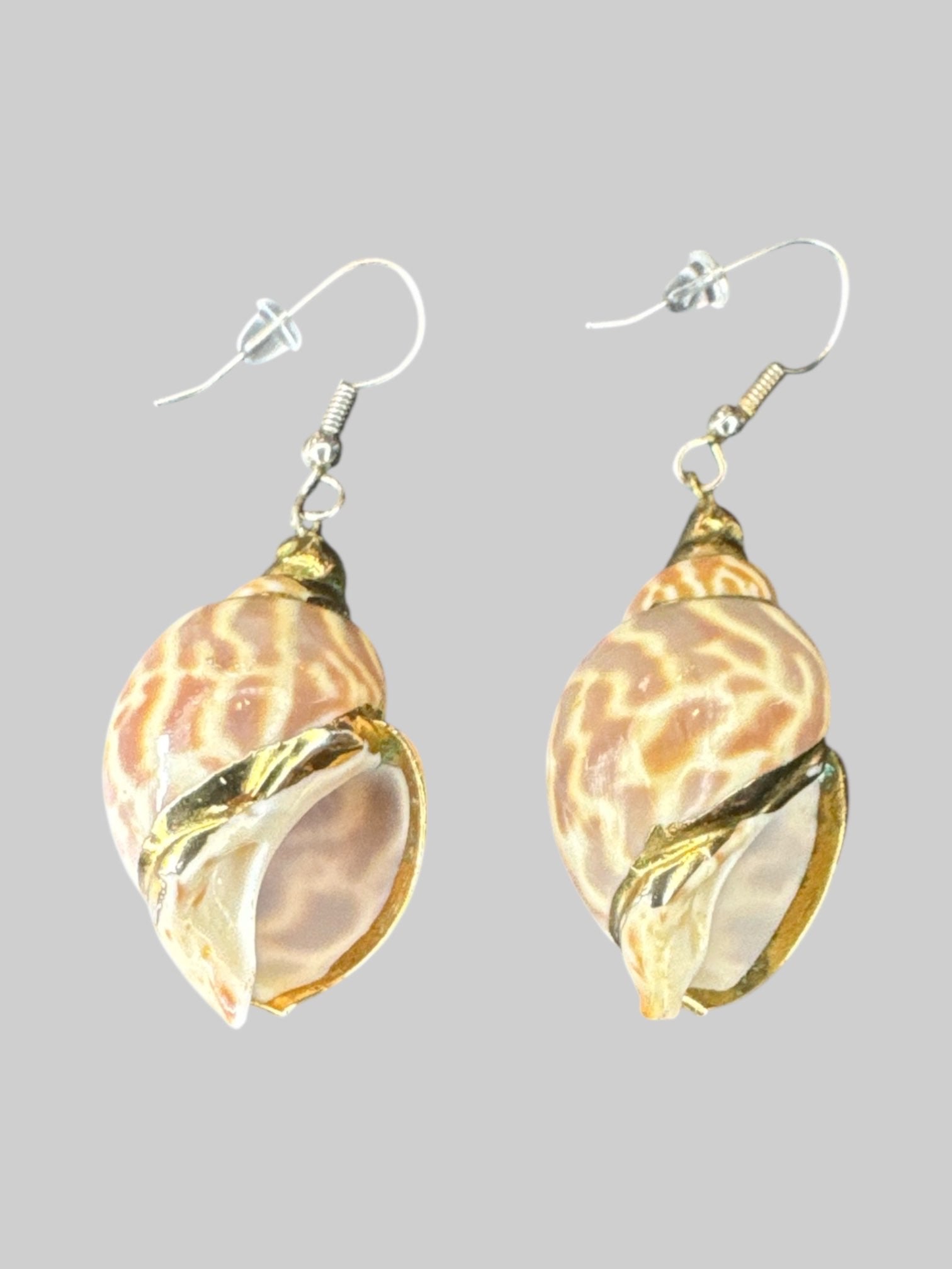 Conch shell earrings with gold tone details