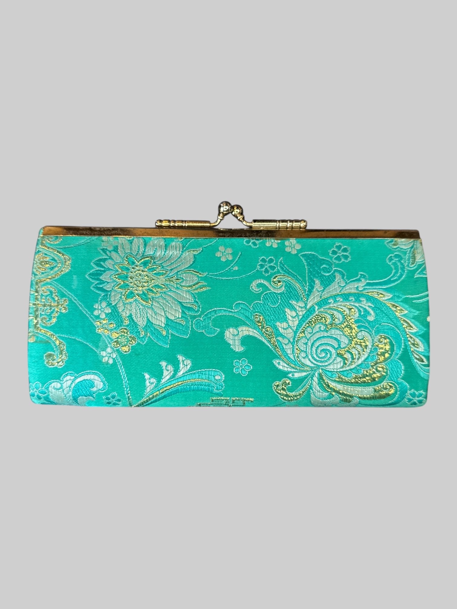 Turquoise clutch with ornate tinsel embroidery, and red inside