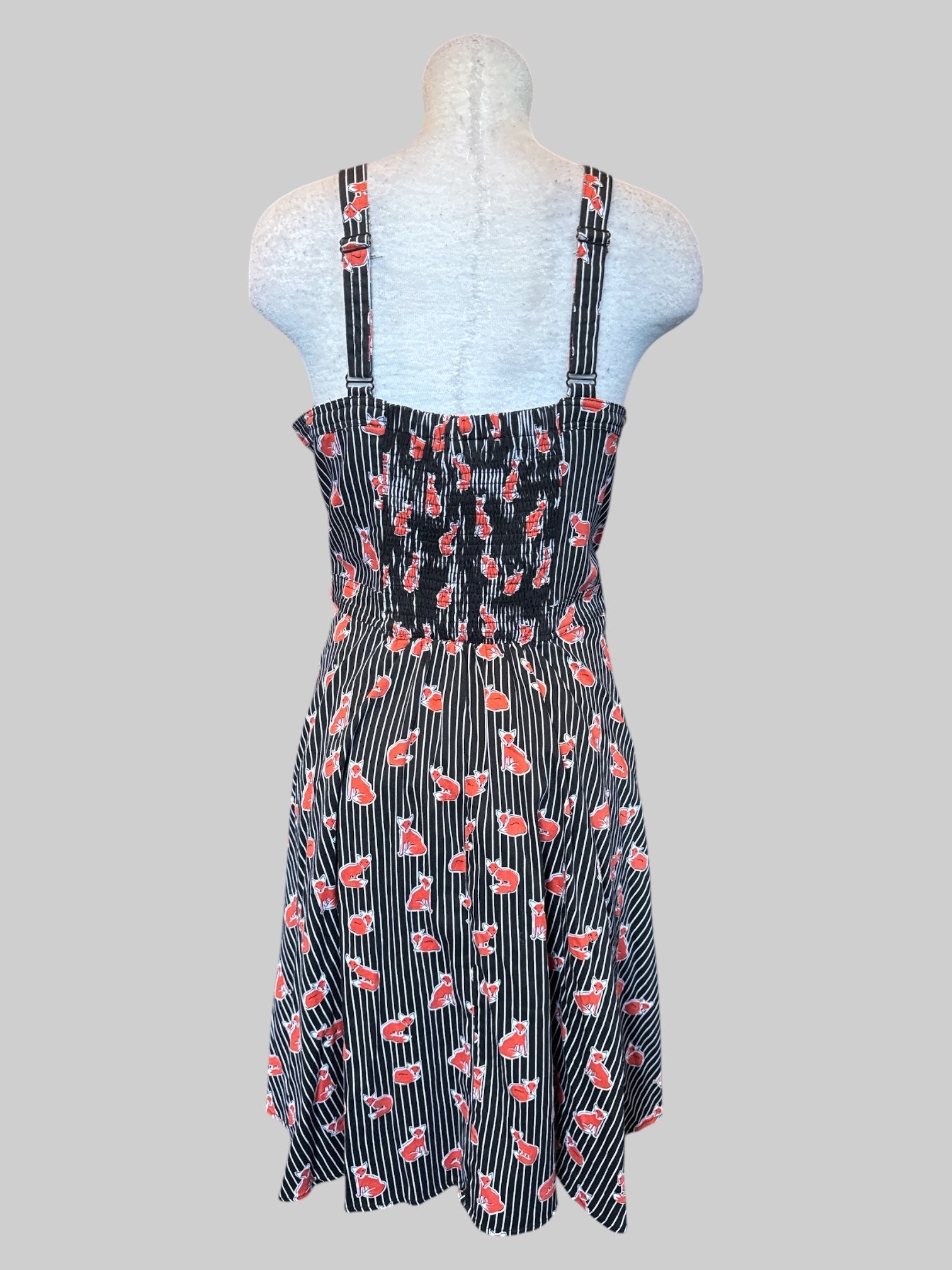 1X Black and white striped sleeveless dress with red fox print, phone buttons on front, shirred back, and pockets