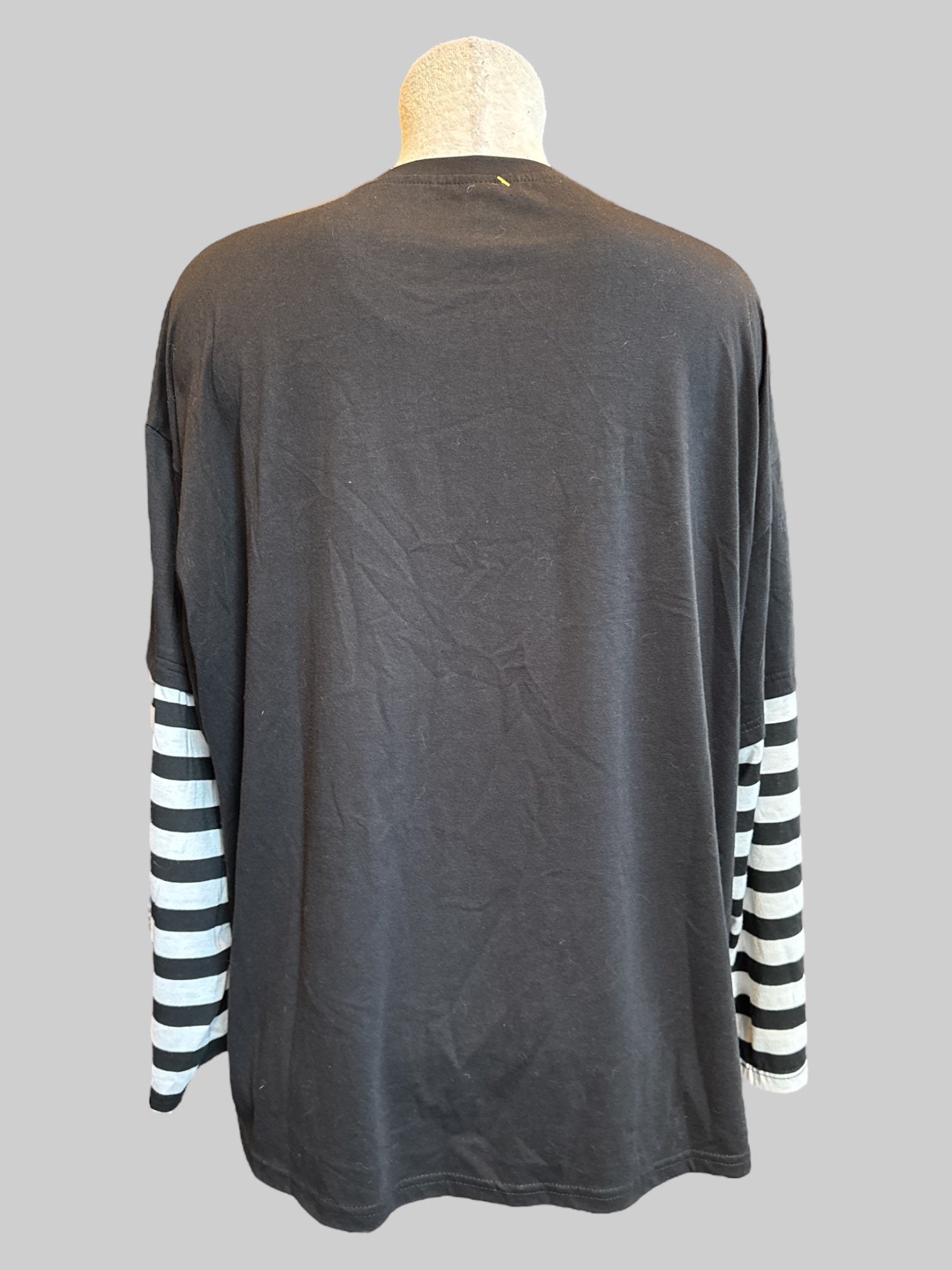 2X Black long sleeve top with skeleton fairy graphic, and black and white striped sleeves