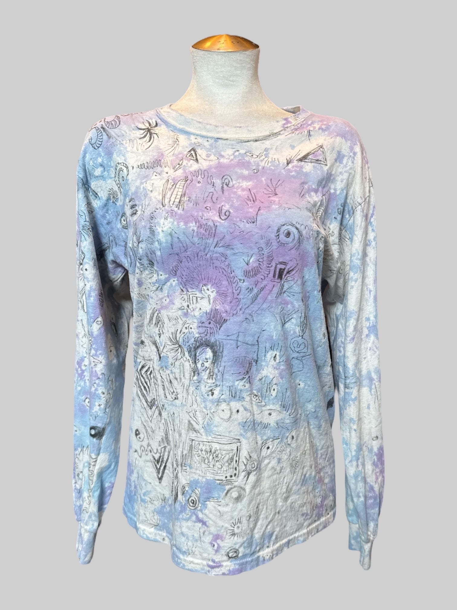 M Long sleeve blue, purple, and white tie dye shirt with art by Kevin Emerson