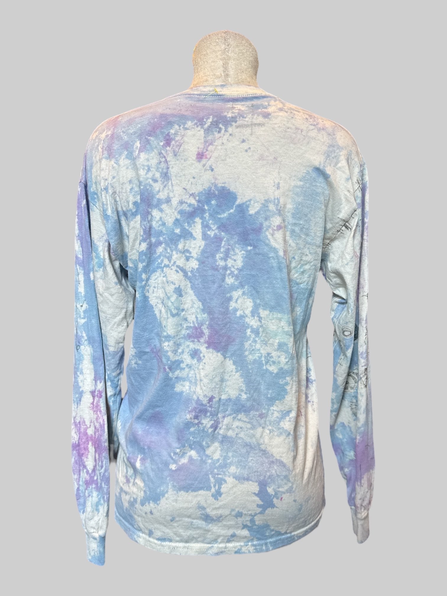 M Long sleeve blue, purple, and white tie dye shirt with art by Kevin Emerson