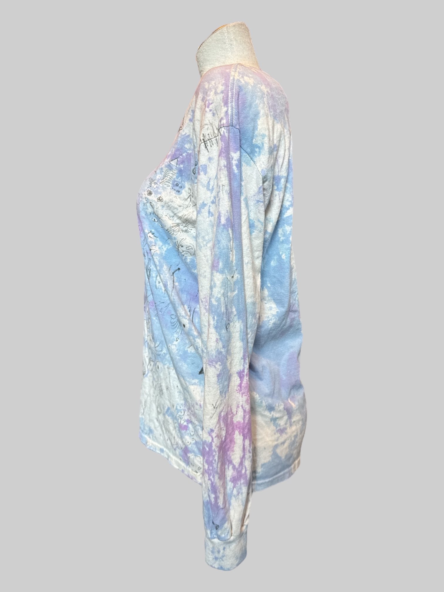 M Long sleeve blue, purple, and white tie dye shirt with art by Kevin Emerson