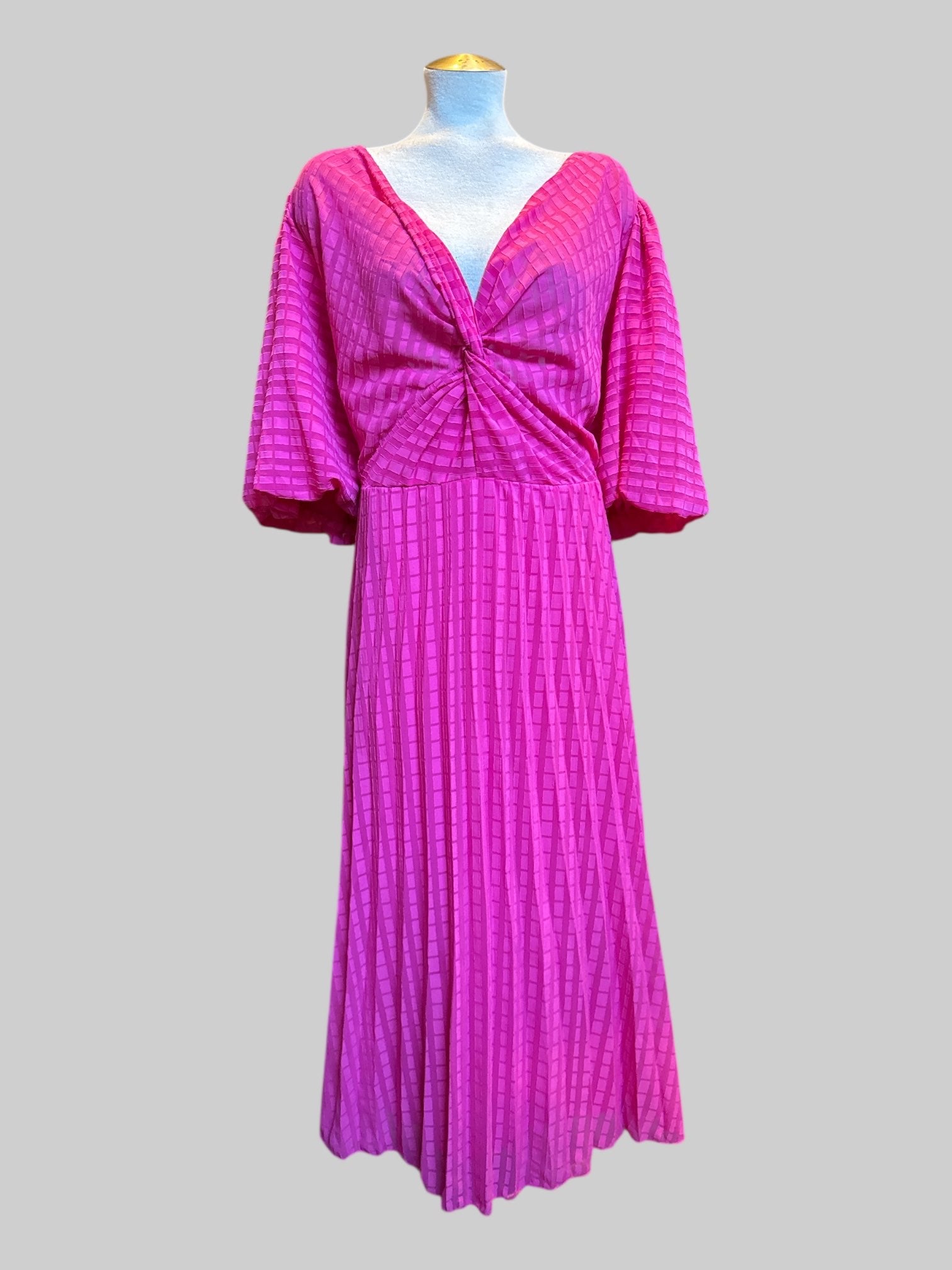 3X flowy pink dress with balloon sleeves, shirred waist, and abstract grid texture