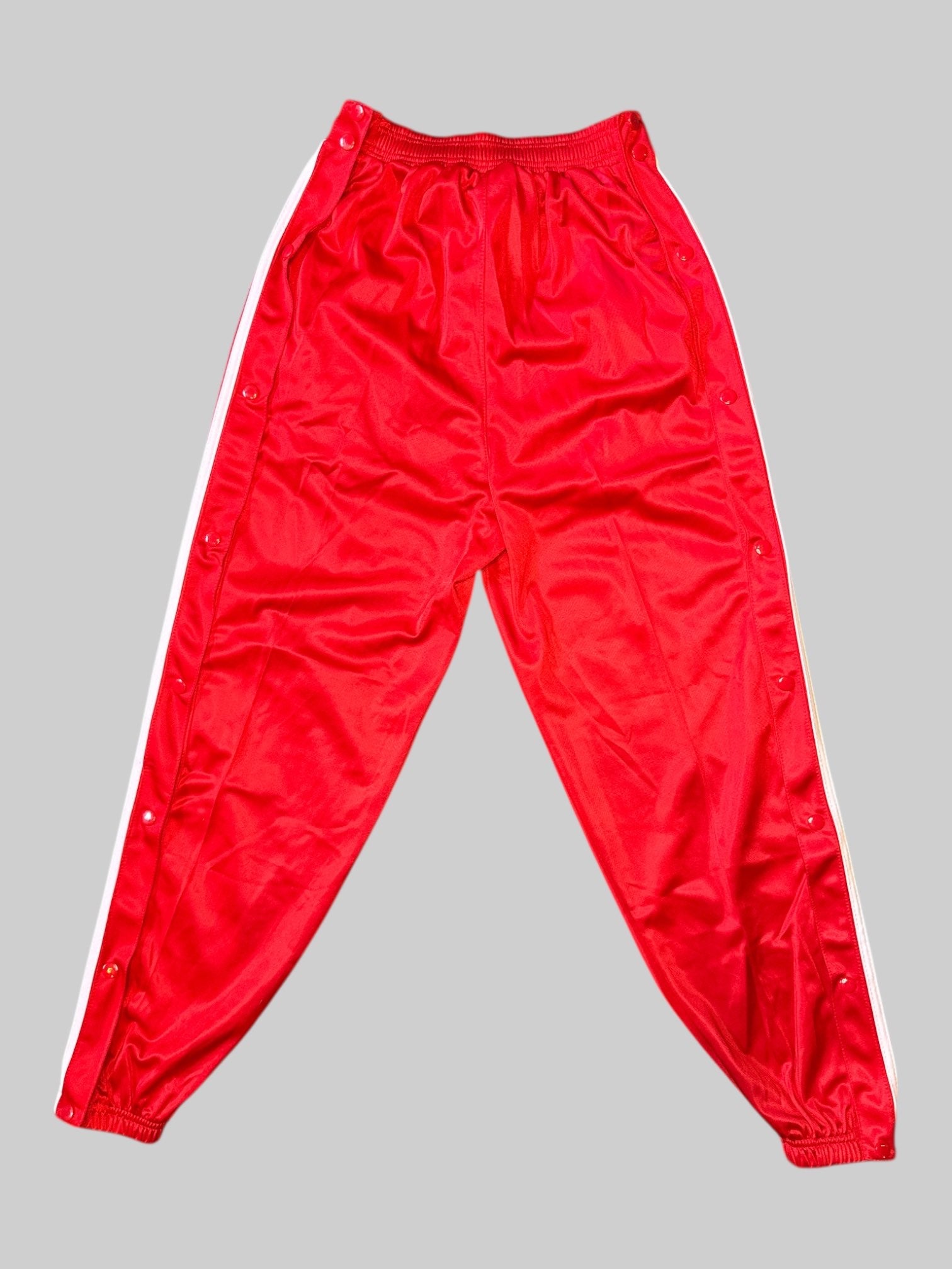 M Red track pants with white stripes, and tear away buttons