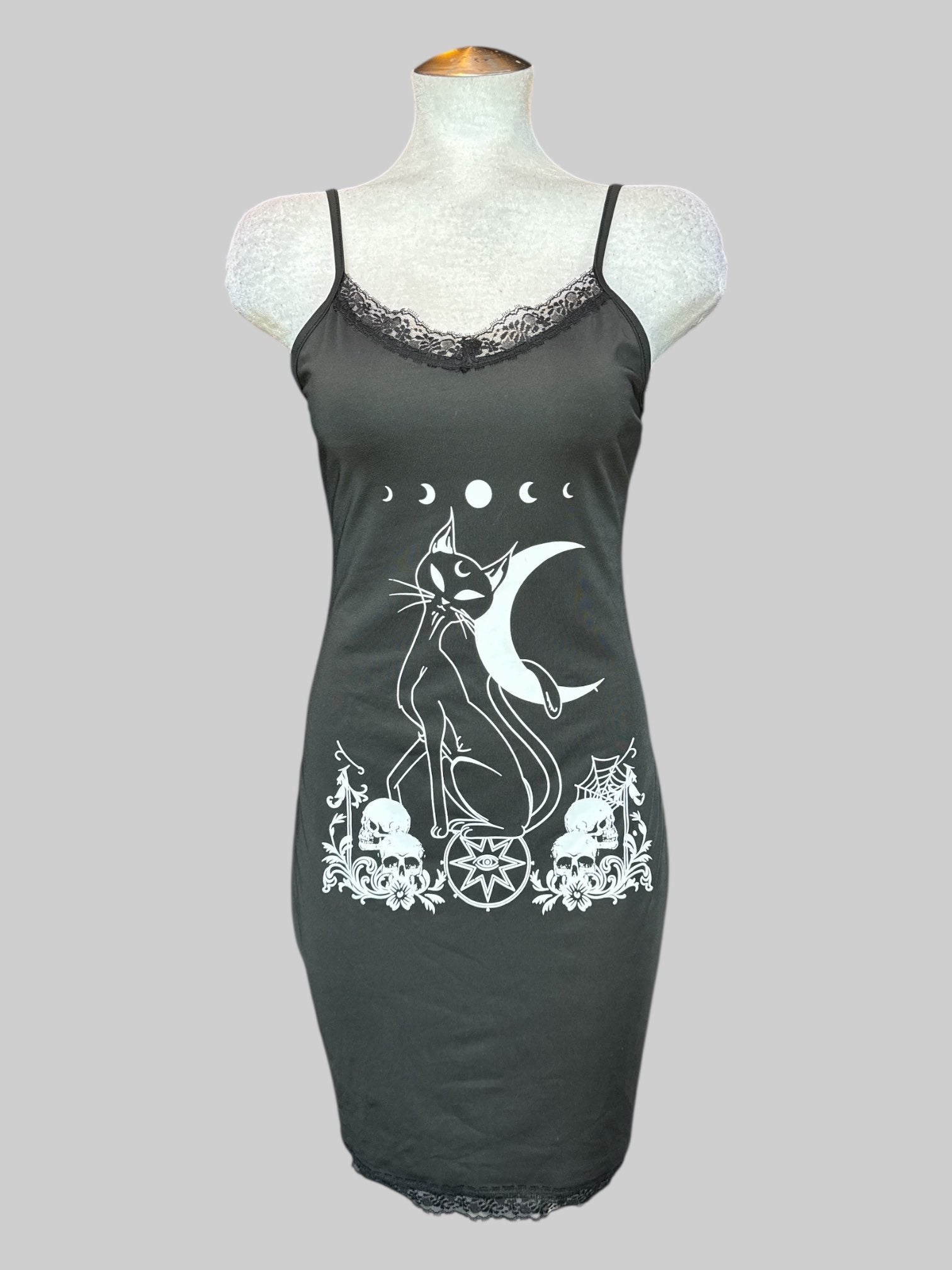 L Black sleeveless slip dress with lace neck line and witchy cat decal