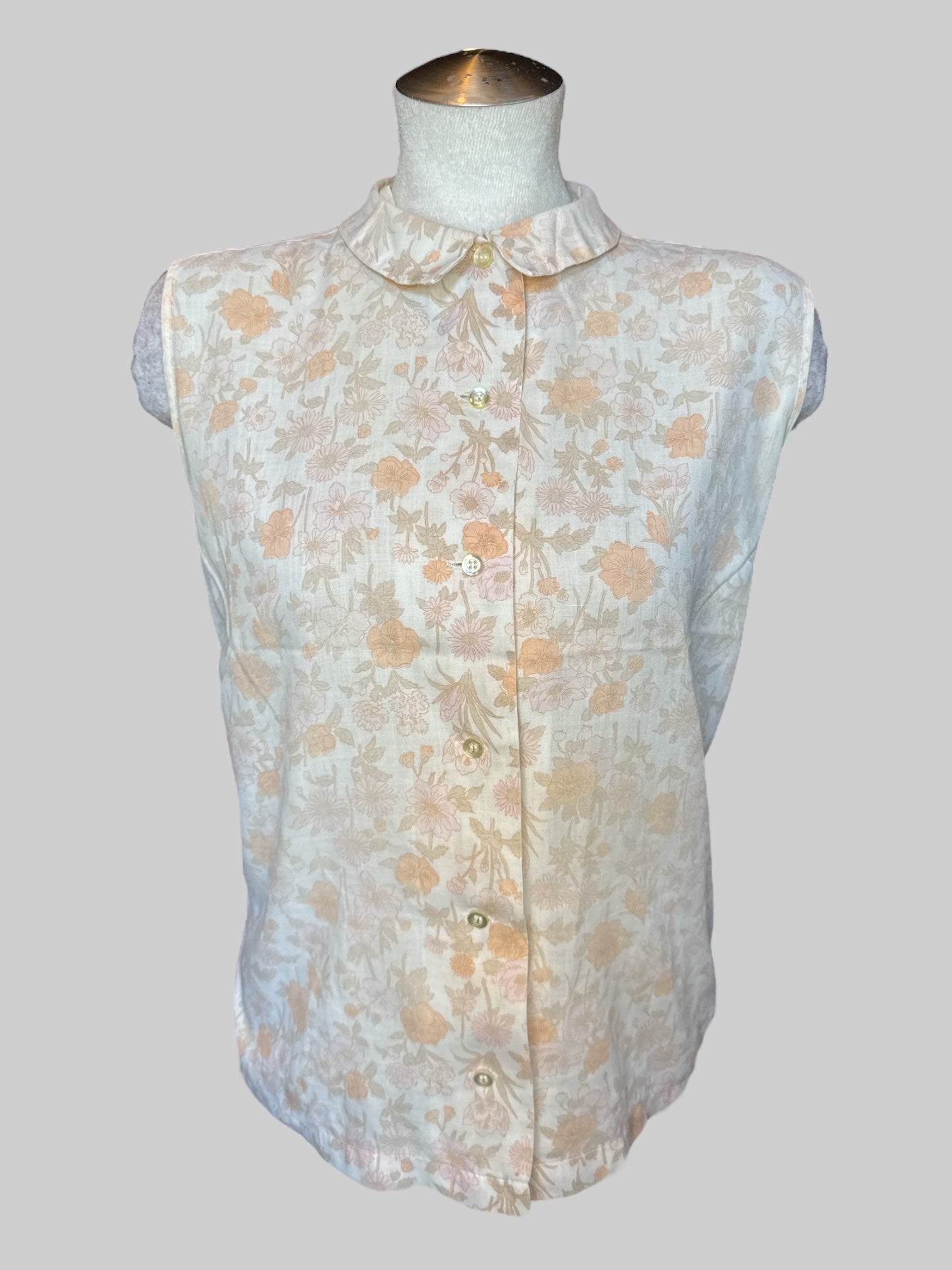L Off-white sleeveless button-down with pink floral design