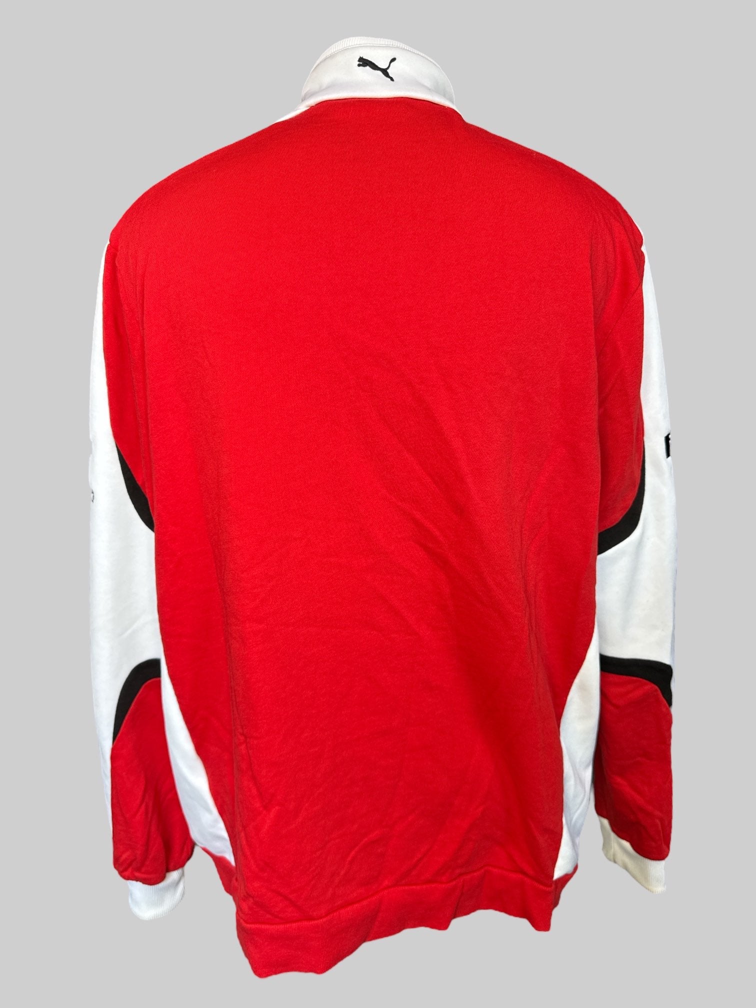 XL Red and white racing jacket with sponsor patches, and some small sweat stains
