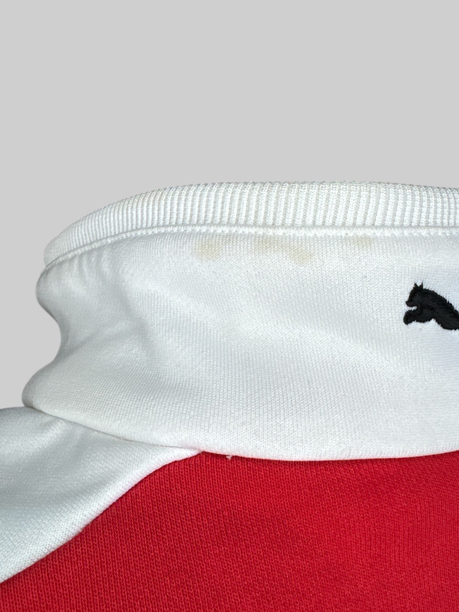 XL Red and white racing jacket with sponsor patches, and some small sweat stains