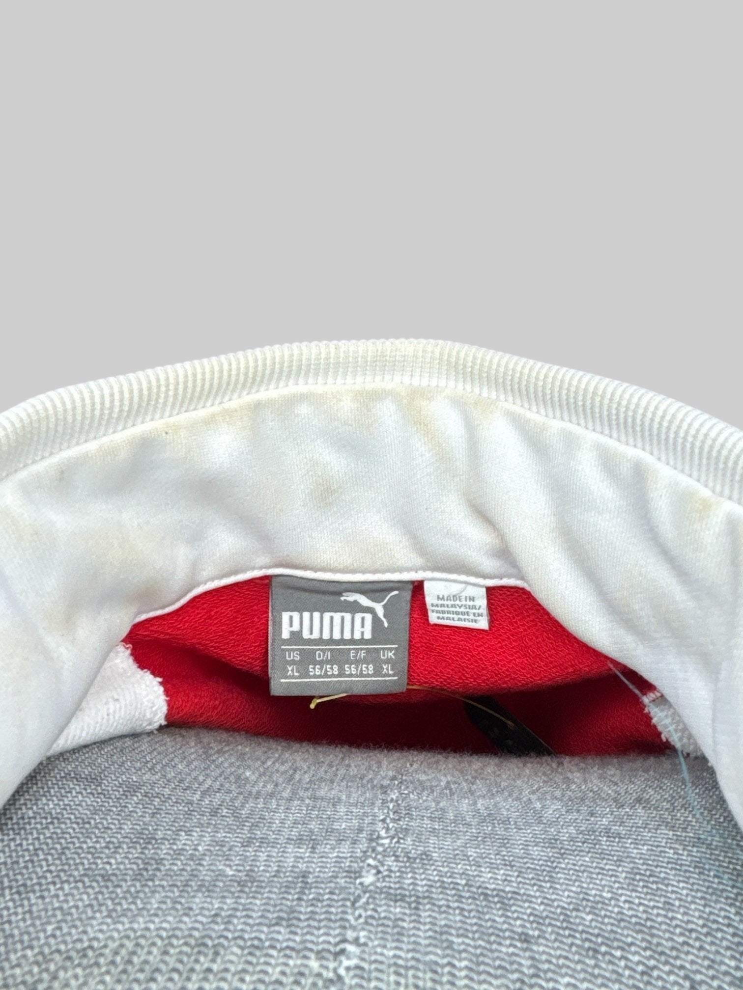 XL Red and white racing jacket with sponsor patches, and some small sweat stains