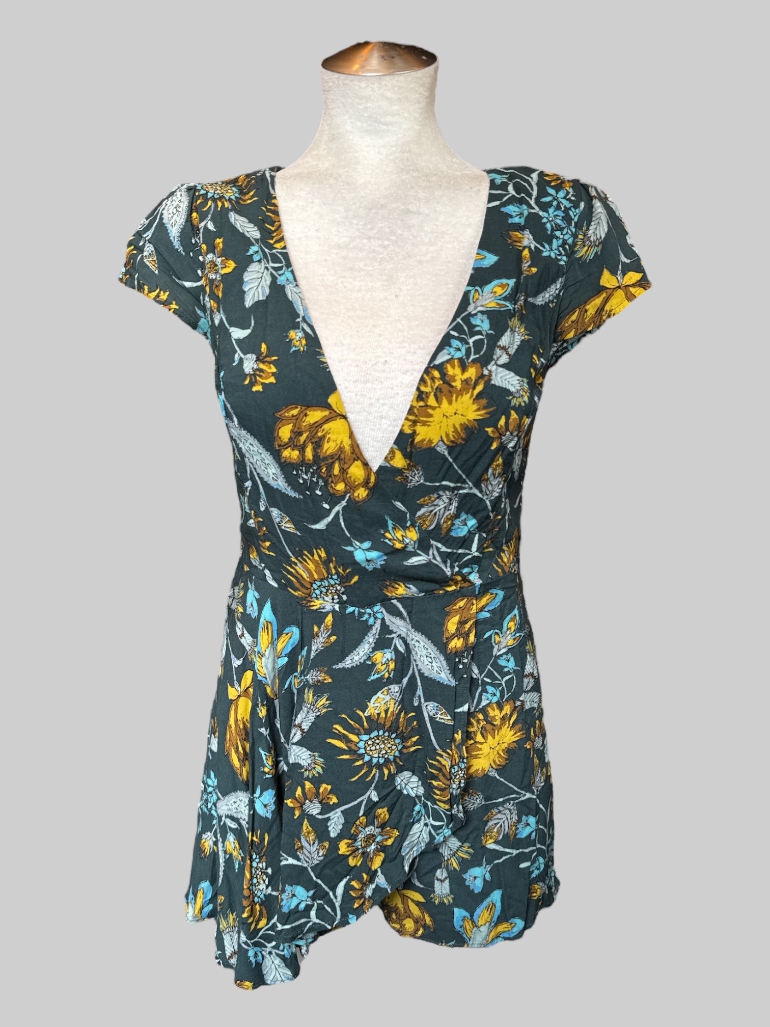 S Teal floral short sleeve faux wrap romper with zipper on back