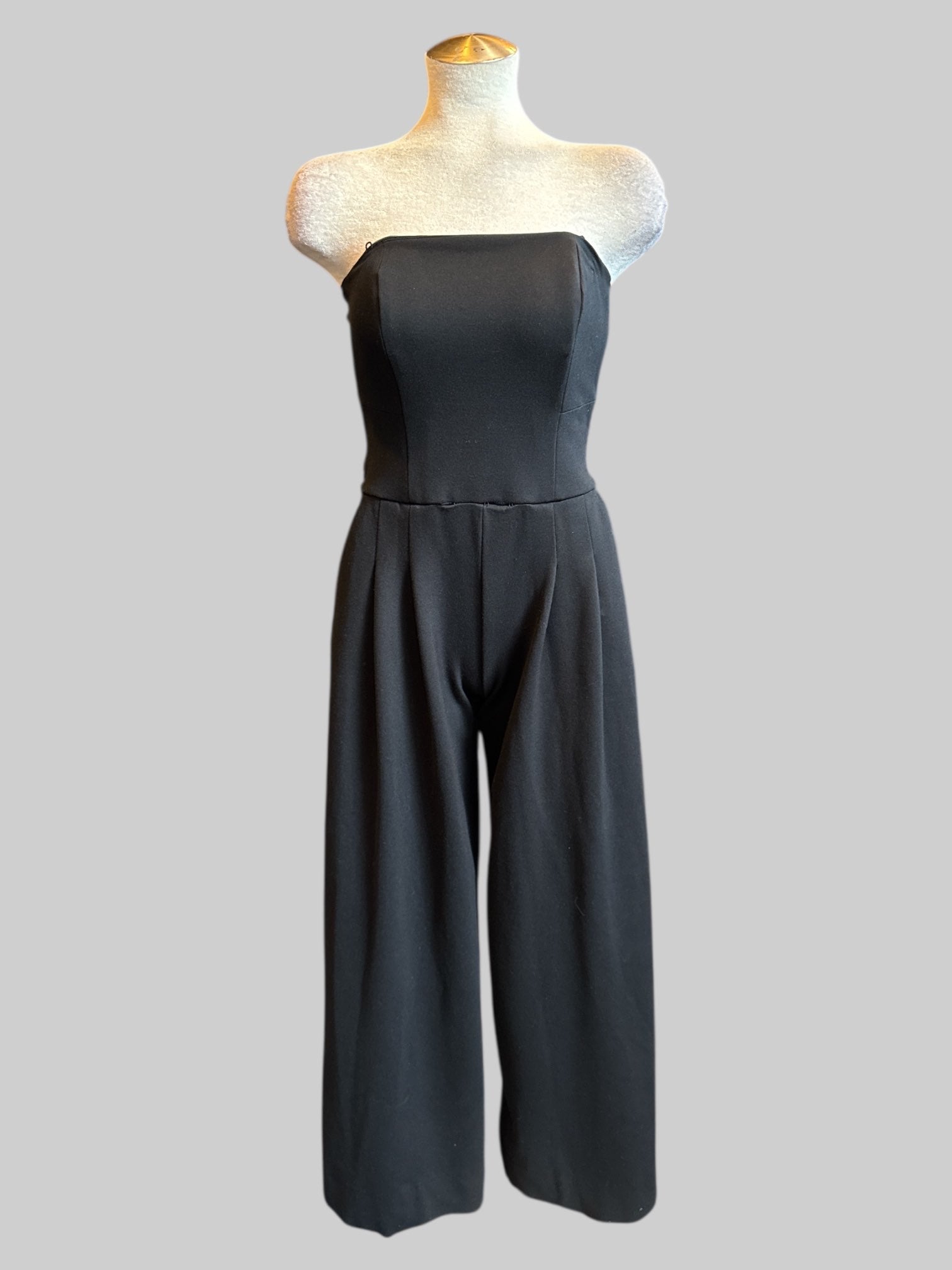 XS Free People black strapless jumpsuit with corset boning, back cut out, and bow