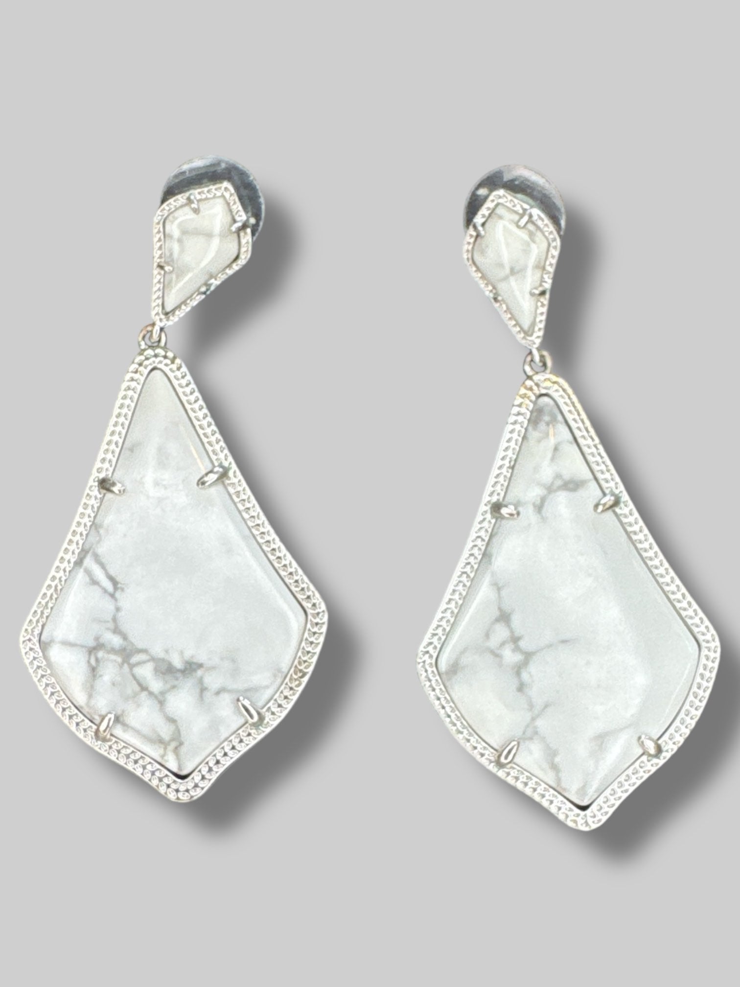 Marble dangle earrings with silver tone borders