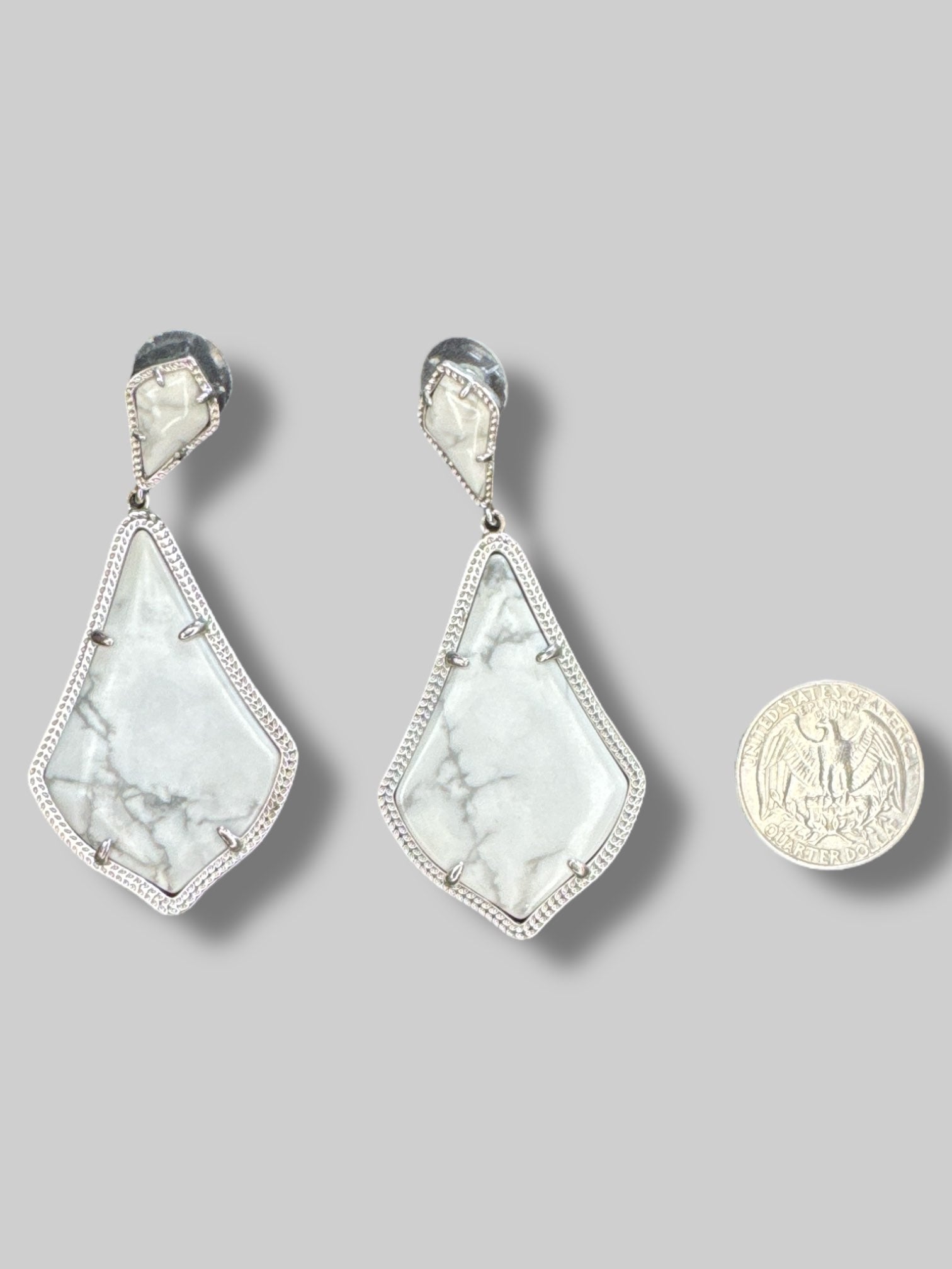Marble dangle earrings with silver tone borders