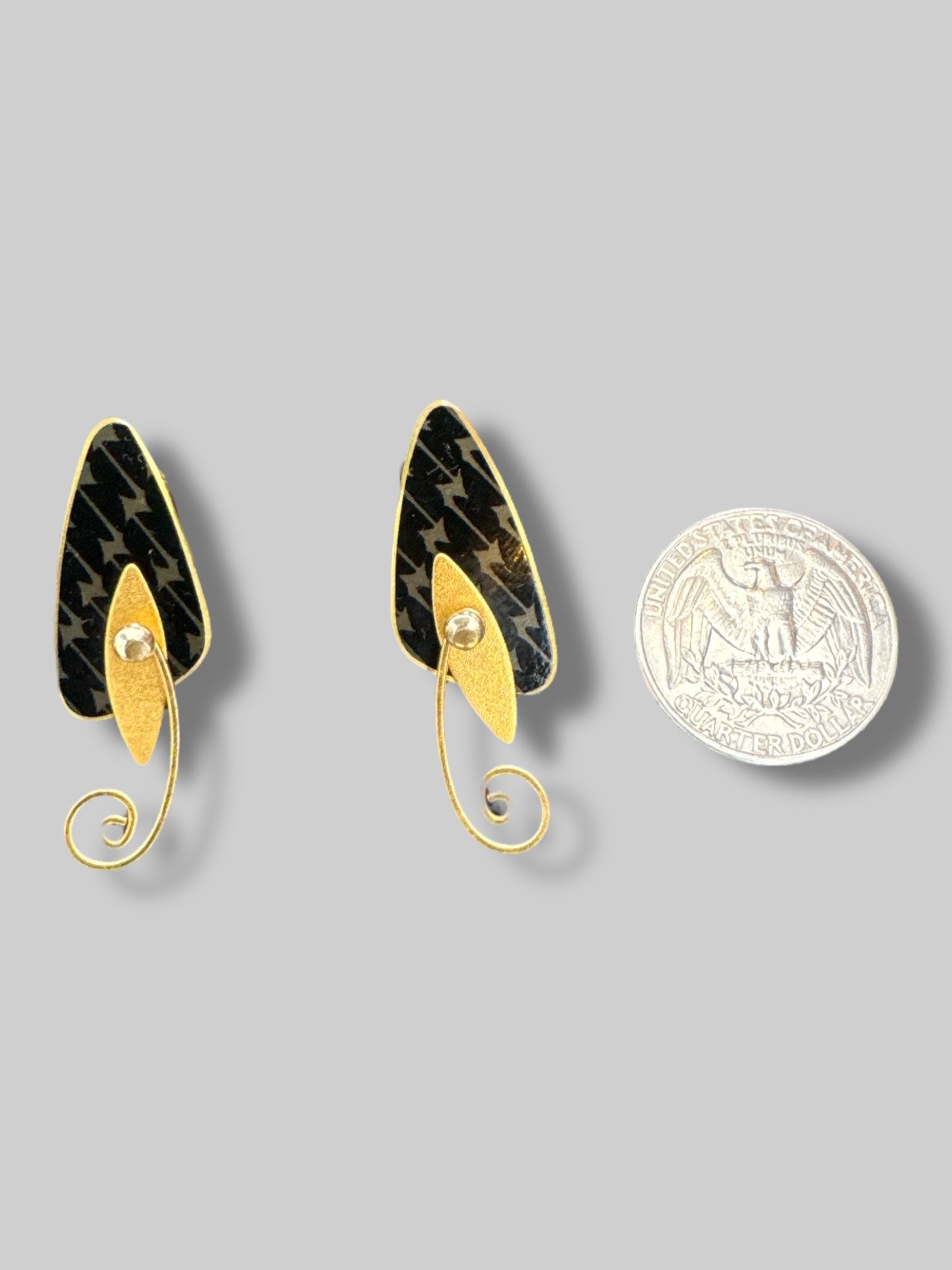 Black and gold dang glee clip on earrings with movable parts