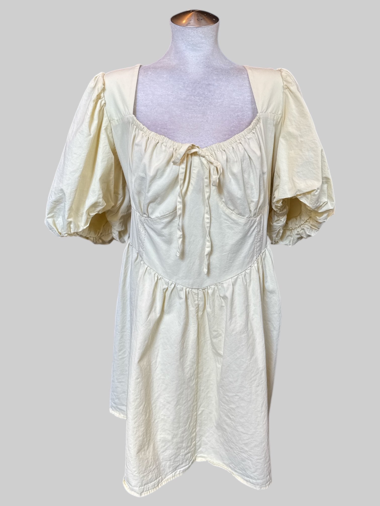 3X Light yellow short sleeve dress with mock corset, shirred back, multiple bows and balloon sleeves