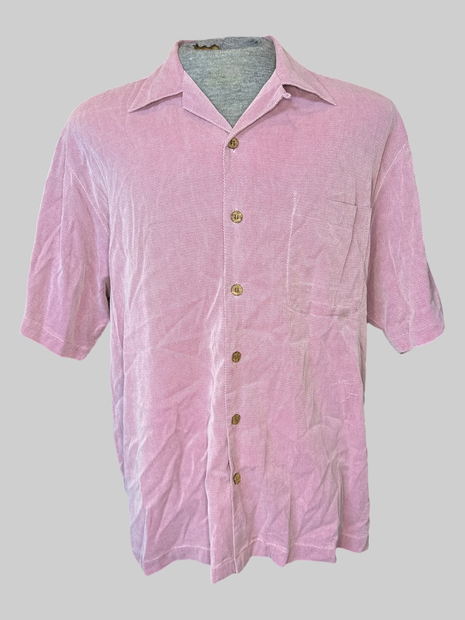 XL Pink short sleeve button down with pocket, wooden buttons, and “ Tommy Bahama island essentials” embroidery on back