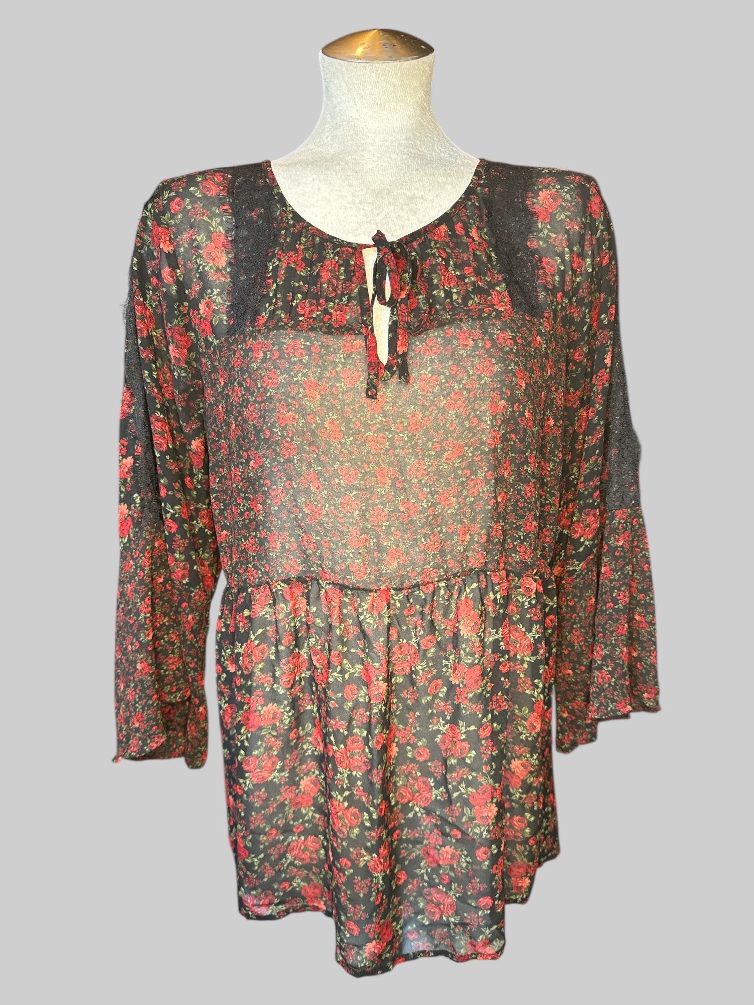 2X Black sheer top with red floral design, pleated design with lace and tie on front, and flared sleeves