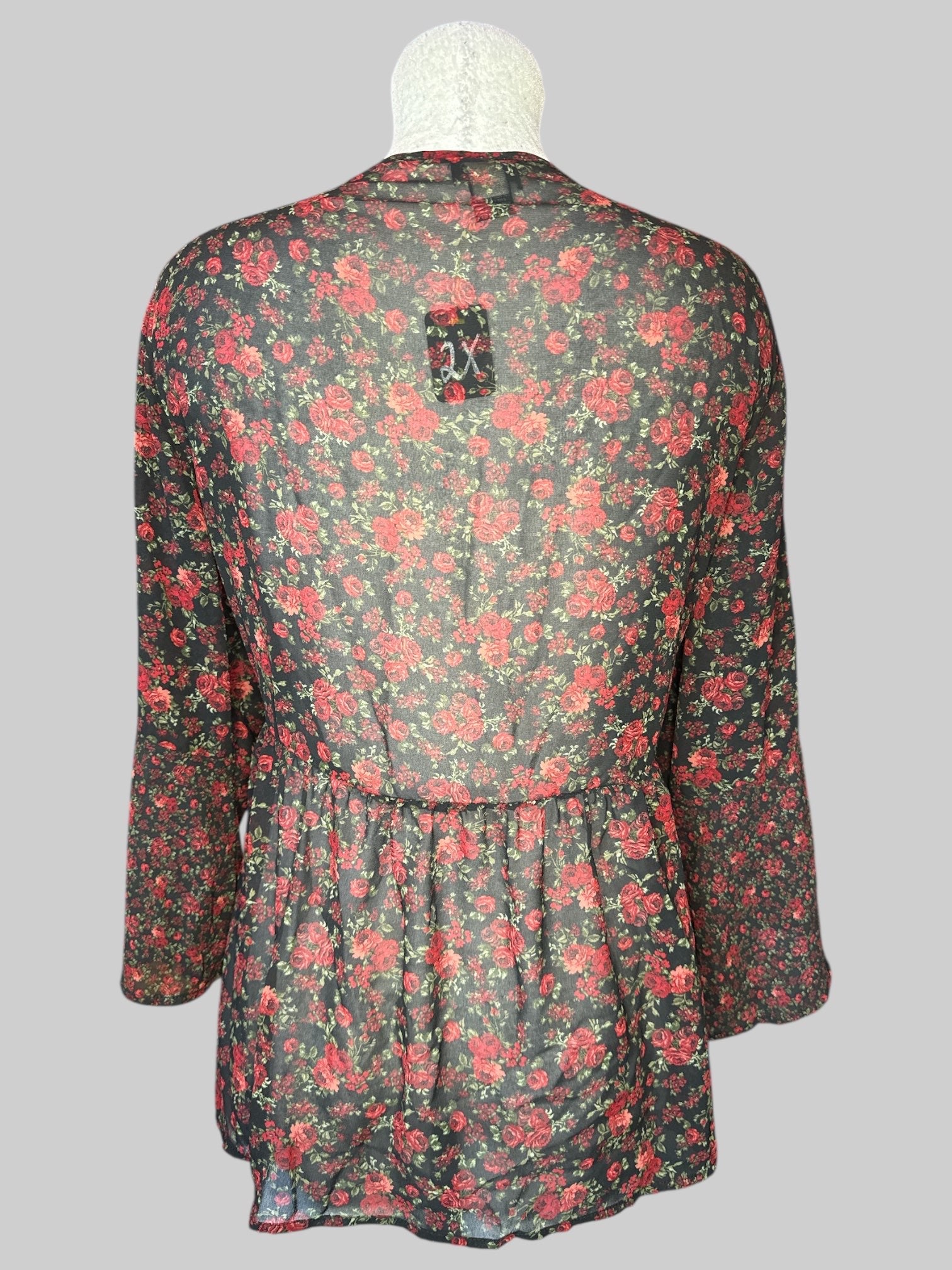 2X Black sheer top with red floral design, pleated design with lace and tie on front, and flared sleeves