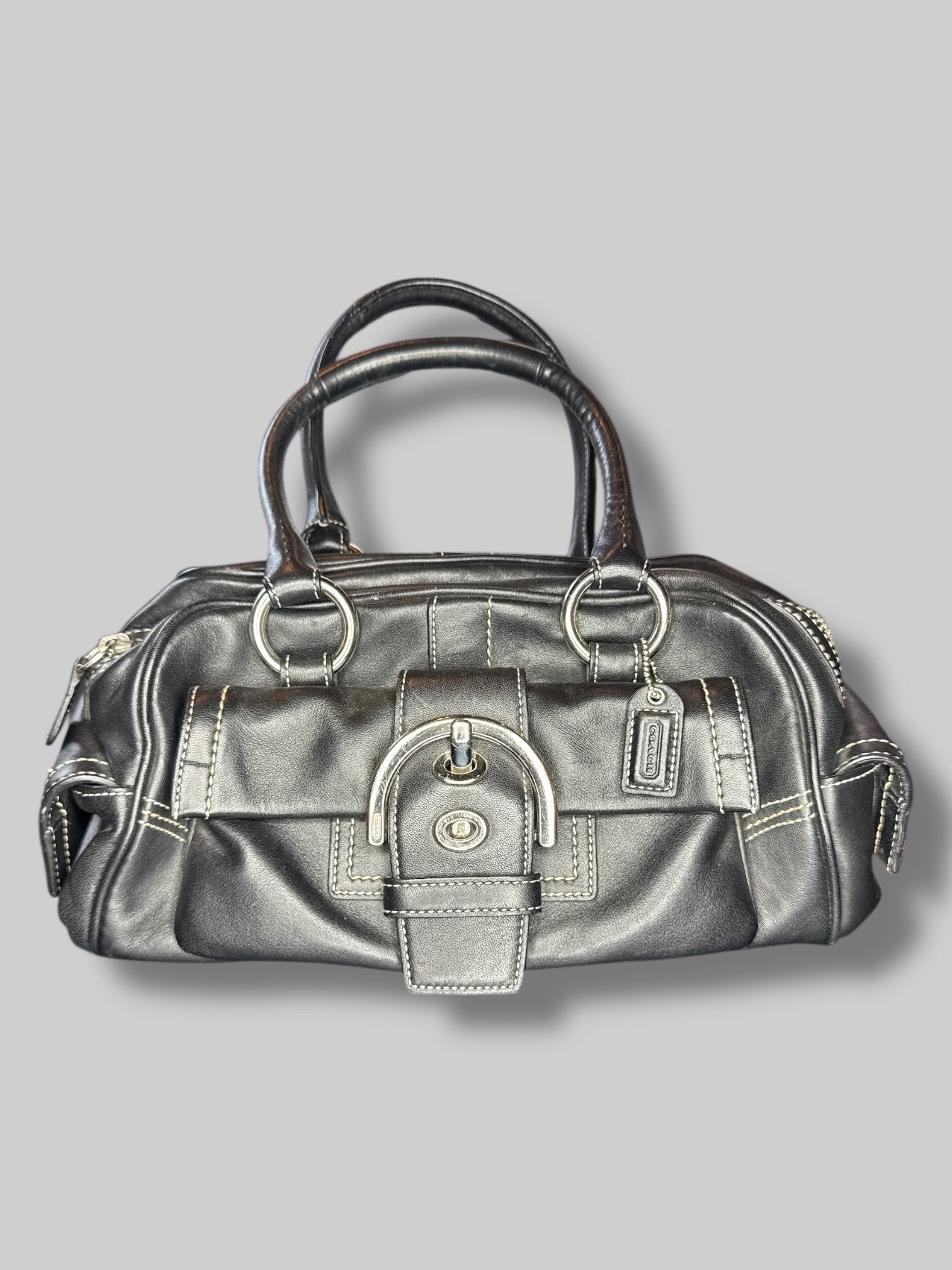Black leather Coach hand bag with multiple pockets inside and out
