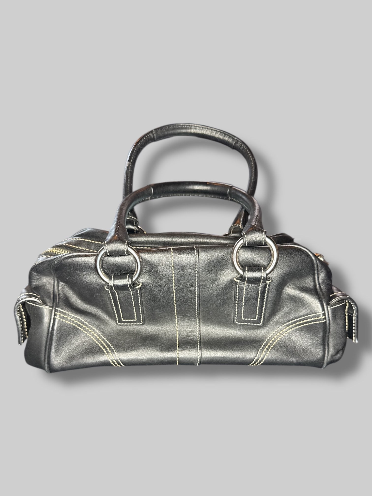Black leather Coach hand bag with multiple pockets inside and out