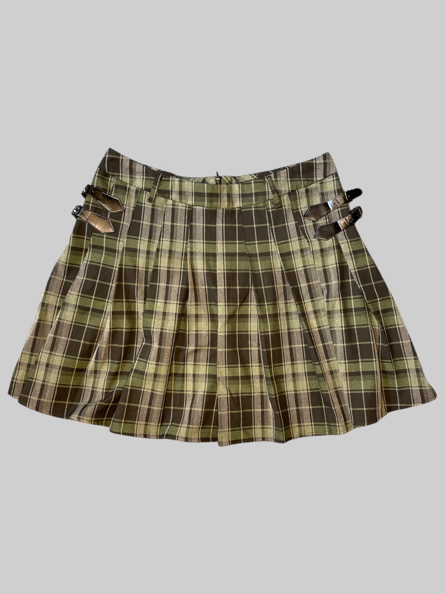 L Green and black plaid pleated skirt with leather buckles on sides, belt loops, and zipper on back