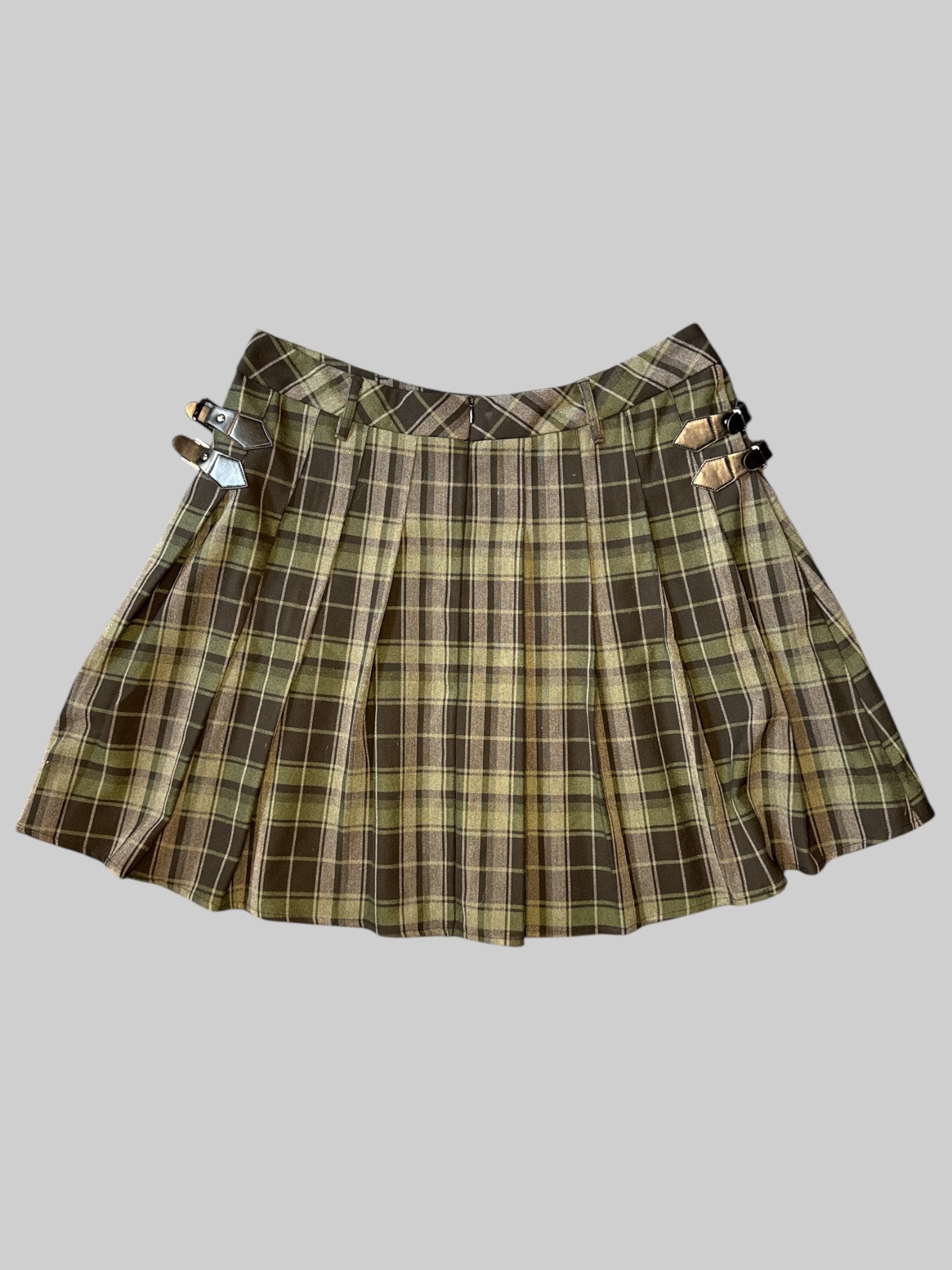 L Green and black plaid pleated skirt with leather buckles on sides, belt loops, and zipper on back