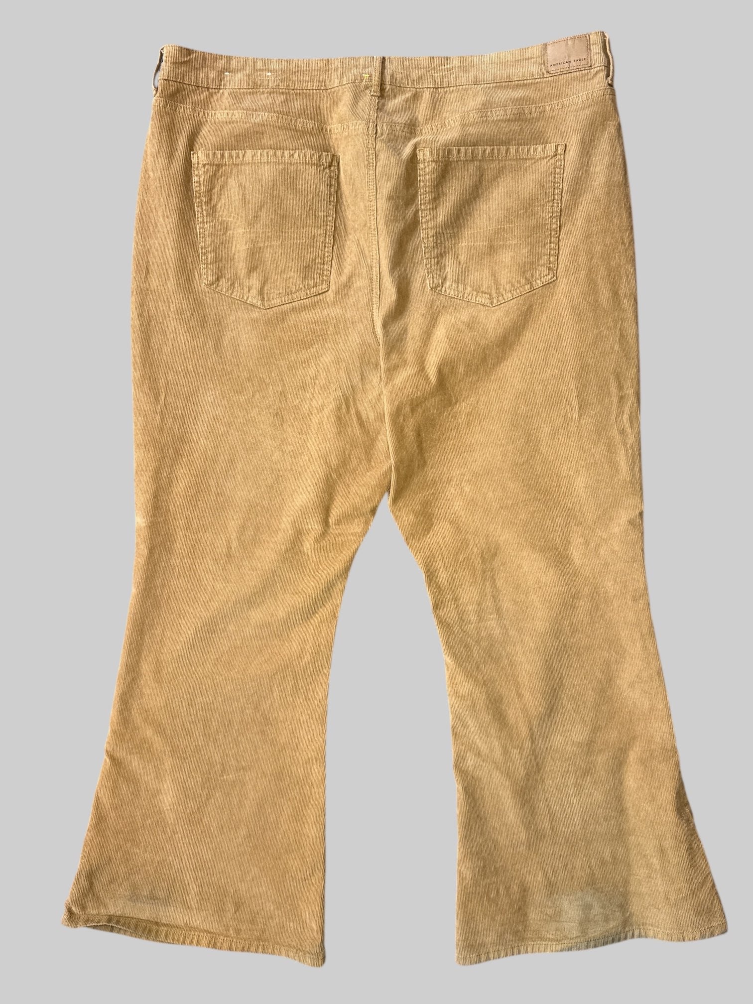 2X Brown corduroy pants with flared legs, pockets, and belt loops