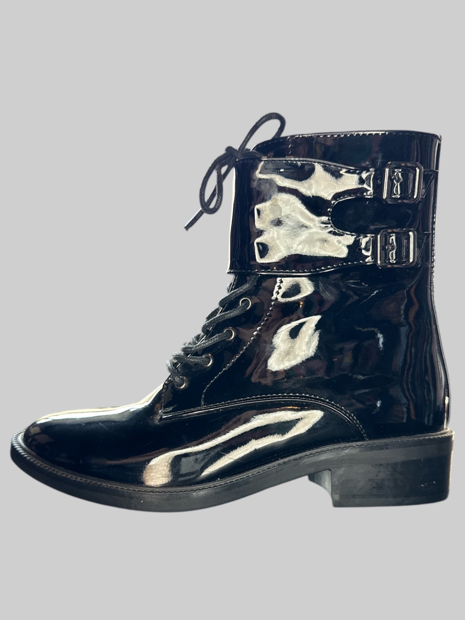 Size 7 Black vinyl boots with lacing, buckles, and zippers on sides