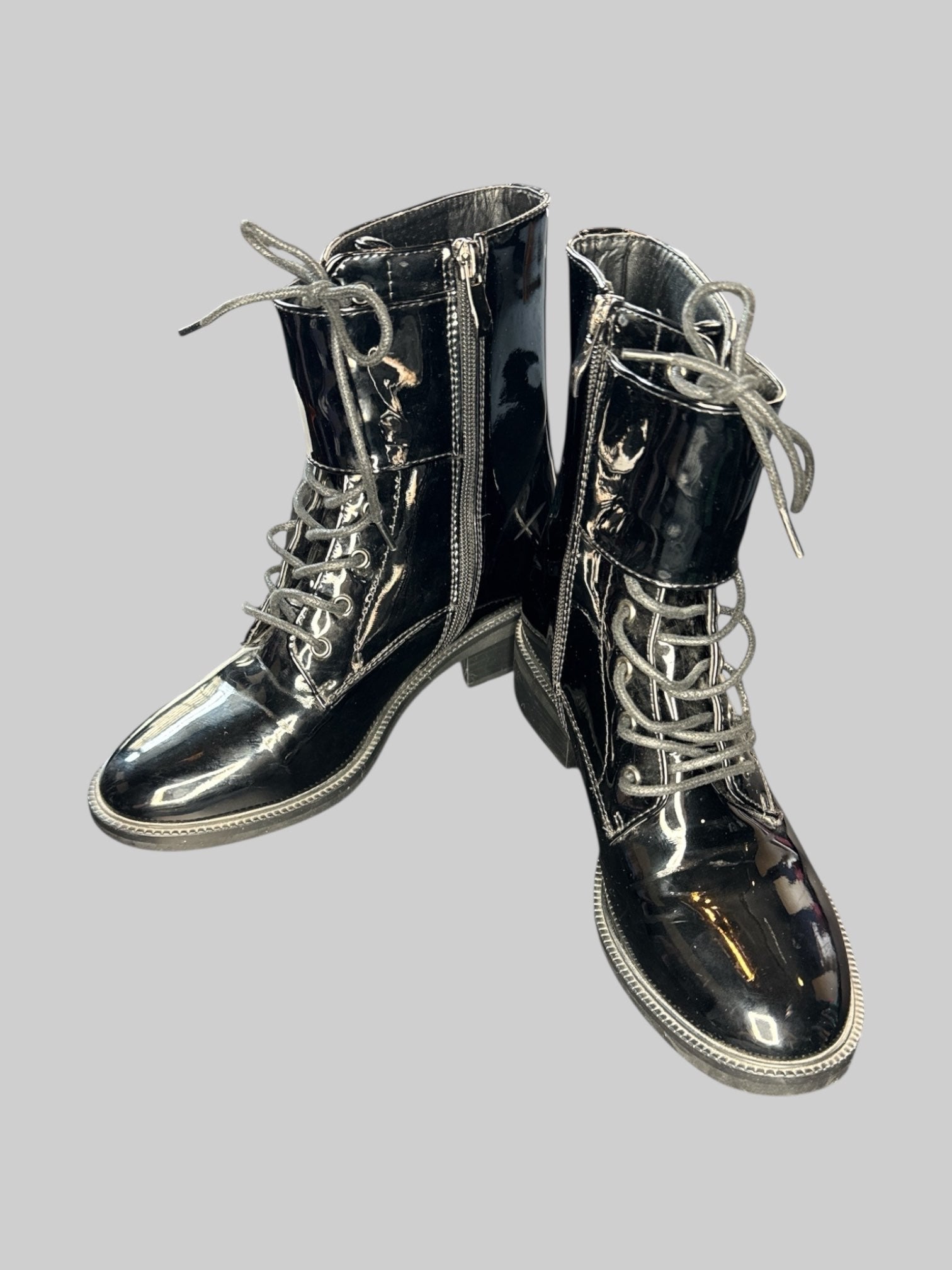 Size 7 Black vinyl boots with lacing, buckles, and zippers on sides