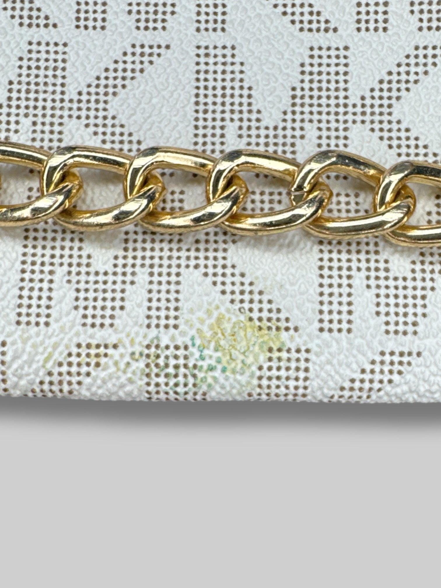 Off-white small Michael Kors bag with small snap button and shoulder strap, and zipper chain