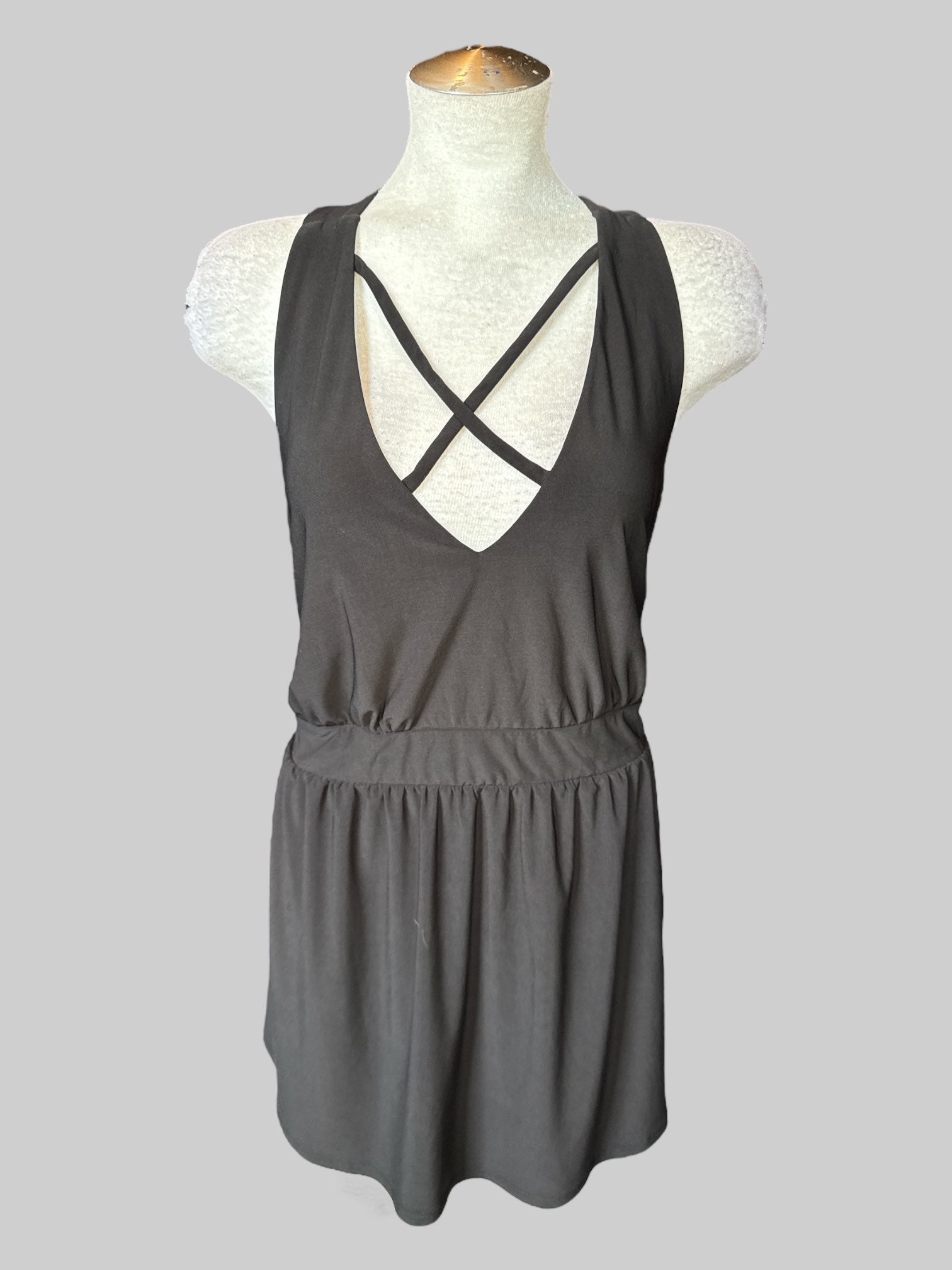 3X Black sleeveless top with straps on neck line and back, and stretchy waist