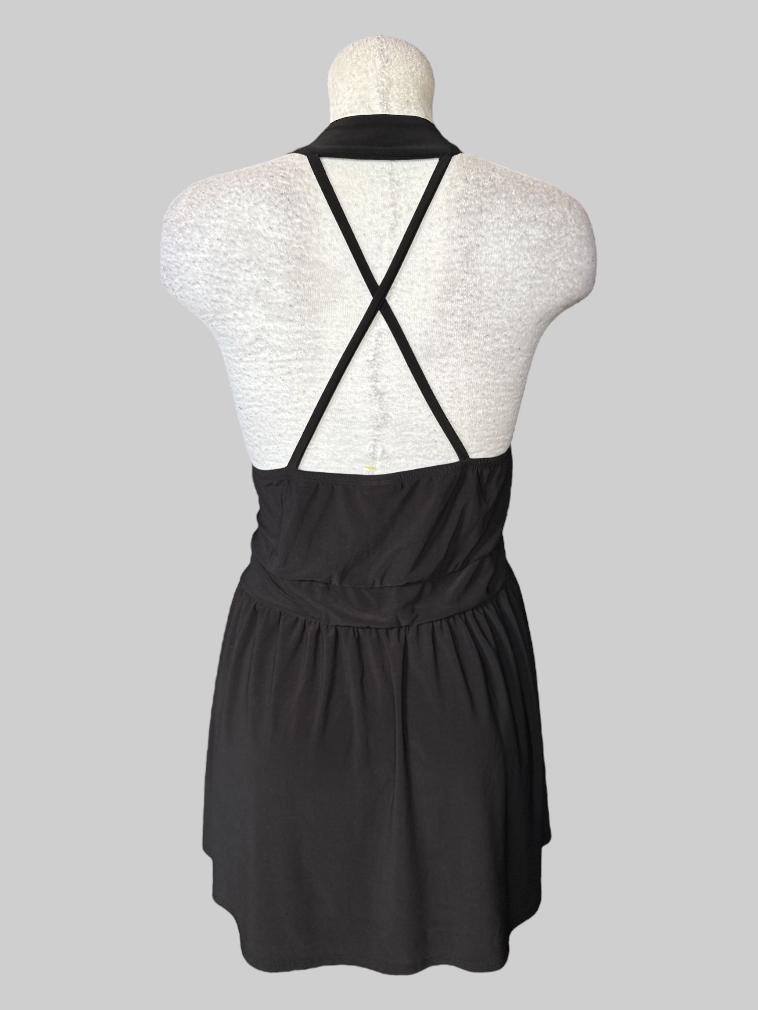 3X Black sleeveless top with straps on neck line and back, and stretchy waist