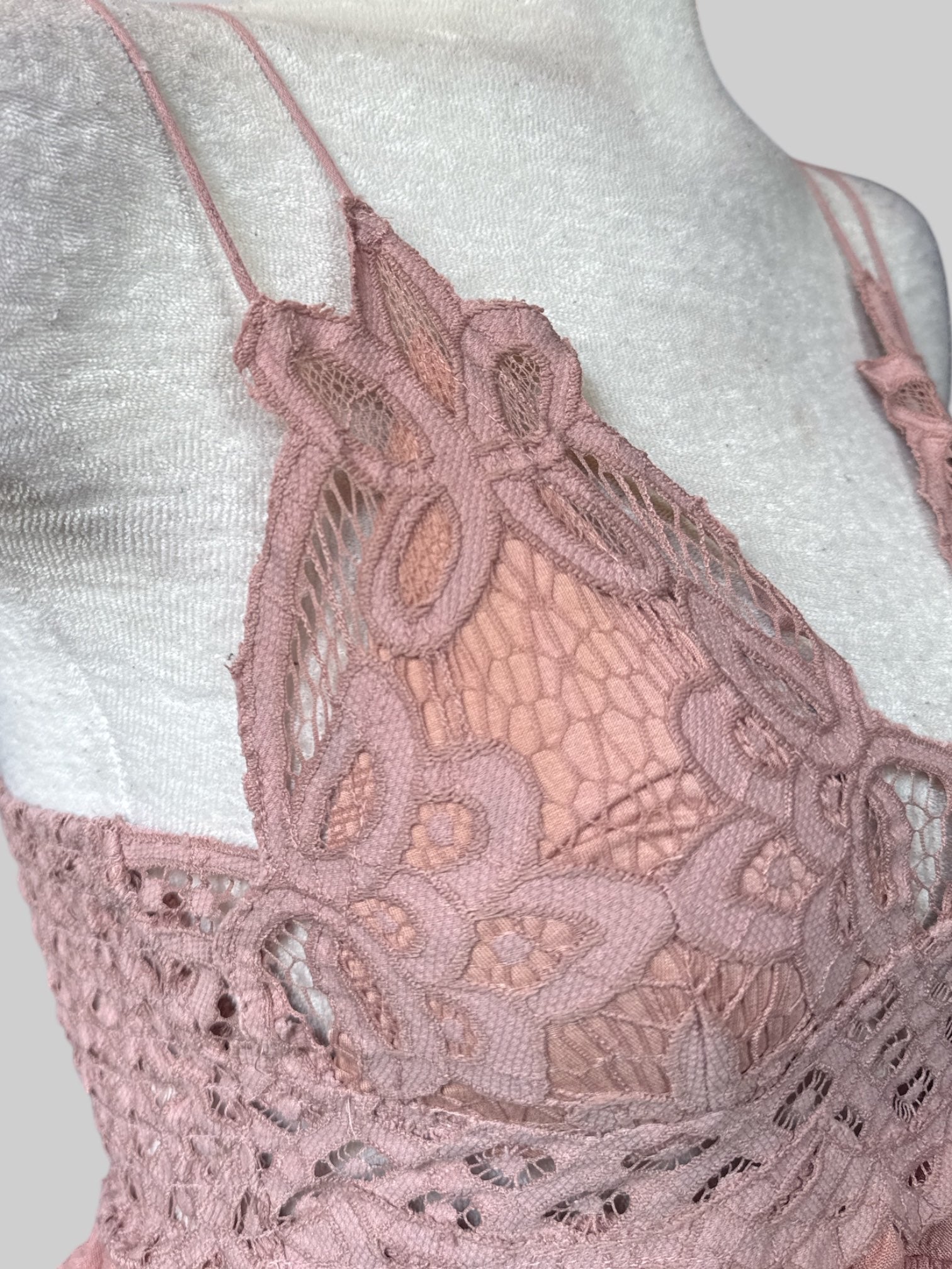 S NWT Free People dusty pink top with cross back, lots of lace, shirred back, and ruffles